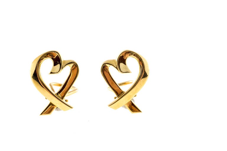 Authentic Tiffany + Co Paloma Picasso solid 18k yellow gold open heart earrings.

Tested and stamped: 18k
Hallmark: Tiffany + Co Paloma Picasso
10.2 grams
Top to bottom: 21.54mm or .85 inch
Width: 15.58mm or .61 inch
Depth: 1.70mm