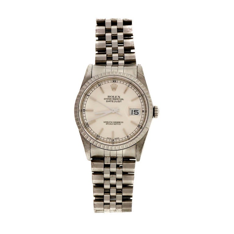 Rolex stainless steel Datejust wristwatch with silvered dial and 18k white gold bezel.

Stainless steel and 18k white gold
Bracelet Length: 7 5/8 inches
Length: 43.65mm
Width: 36mm
Bracelet width at case: 20mm
Case thickness: