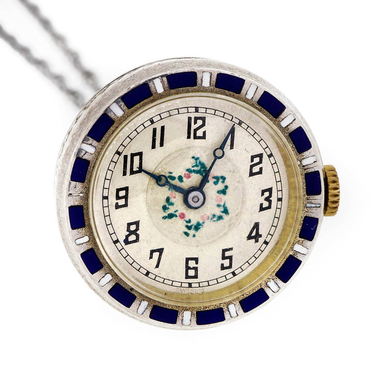 Egyptian Revival motif silver pendant watch circa 1925. Nicolet 15 jewel adjusted movement. Silver case with fine blue enamel. Hand painted dial. Very rare and very nice.

Silver
25.5 grams
22 Inch silver rope chain
Length: Top to bottom: