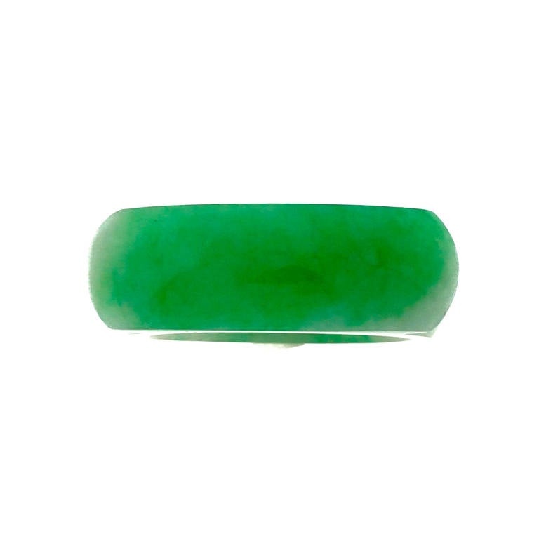 Solid Jadeite Jade Hololith ring excellent condition carved from one piece of solid natural Jade.

1 natural Jadeite Jade ring, variegated green and white, translucent, natural no heat no treatment, GIA certificate #2165330969
Width at top:
