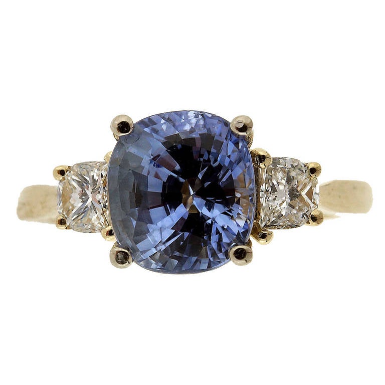 Periwinkle blue natural Sapphire and Diamond three-stone 14k yellow and white gold engagement ring.  .

1 cushion shape Periwinkle blue Sapphire, approx. total weight 2.22cts, VS, 7.48 x 6.80 x 5.19mm, simple heat only, no other enhancements, AGL
