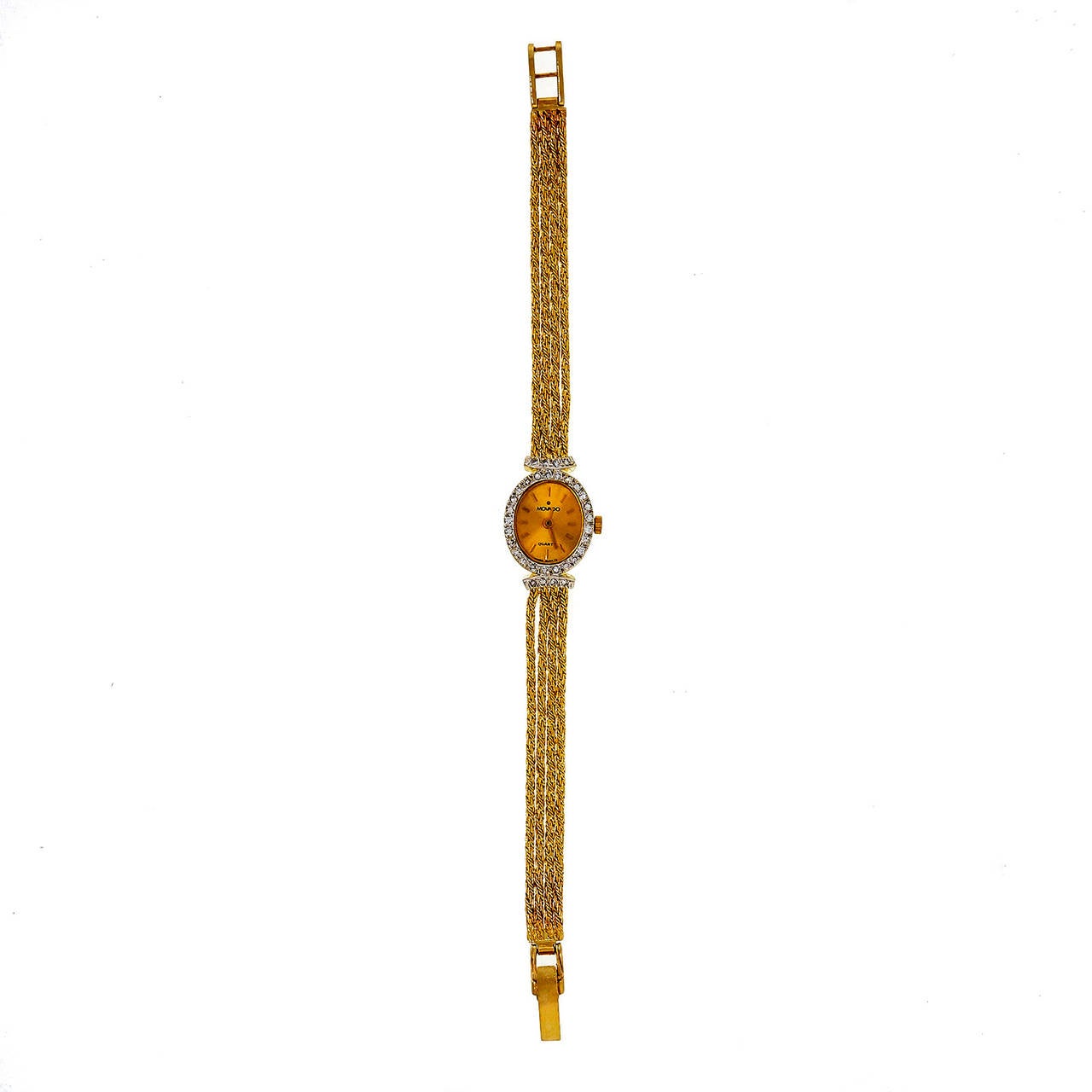 Movado Lady's 14k Yellow Gold and Diamond Wristwatch with Quartz Movement.

14k yellow gold
Bracelet length: 6.25 inches
Length: 21.62mm
Width: 14.6
Braclet width at case: 7mm
Bracelet: 4 strands 14k gold Movado Buckle
Case thickness: