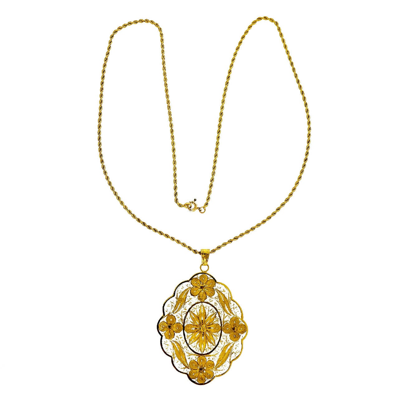 Extra fine handmade delicate filigree pendant made from hundreds of pieces of thin wire all soldered into this beautiful pendant. Circa 1900-1920.

14k & 20k yellow gold
Top to bottom: 45.5mm or 1.79 inches
Width: 34.4mm or 1.35 inches
Depth: