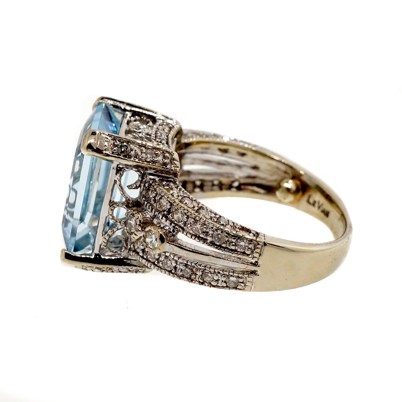 Le Vian 14k white gold ring with a beautiful well-polished genuine Aqua center and nice diamond accents.

1 emerald cut light greenish blue natural Aqua, approx. total weight 4.75cts, VS, 12 x 9.8mm
66 full cut diamonds, approx. total weight