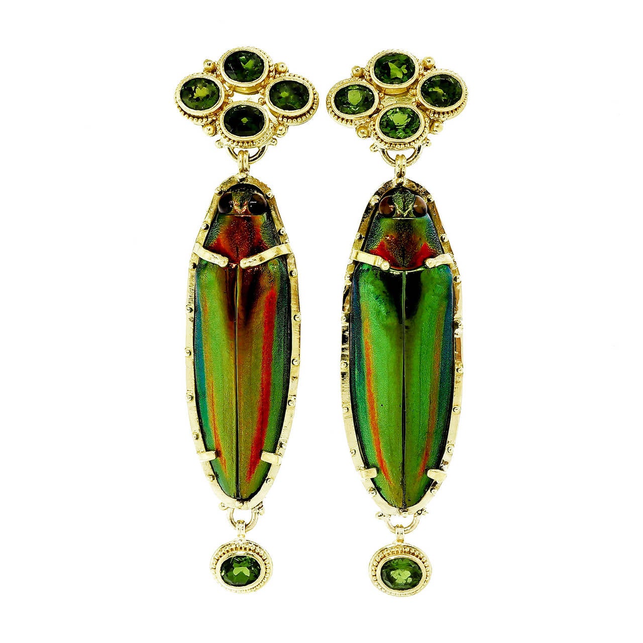 Totally handmade by the famous goldsmith Luna Felix. Granulated 22k and 18k yellow gold dangle earrings with rare bright green scarabs and gem green Tourmalines. Made and appraised by Luna Felix for $8,500.

8 gem bright green oval Tourmaline,