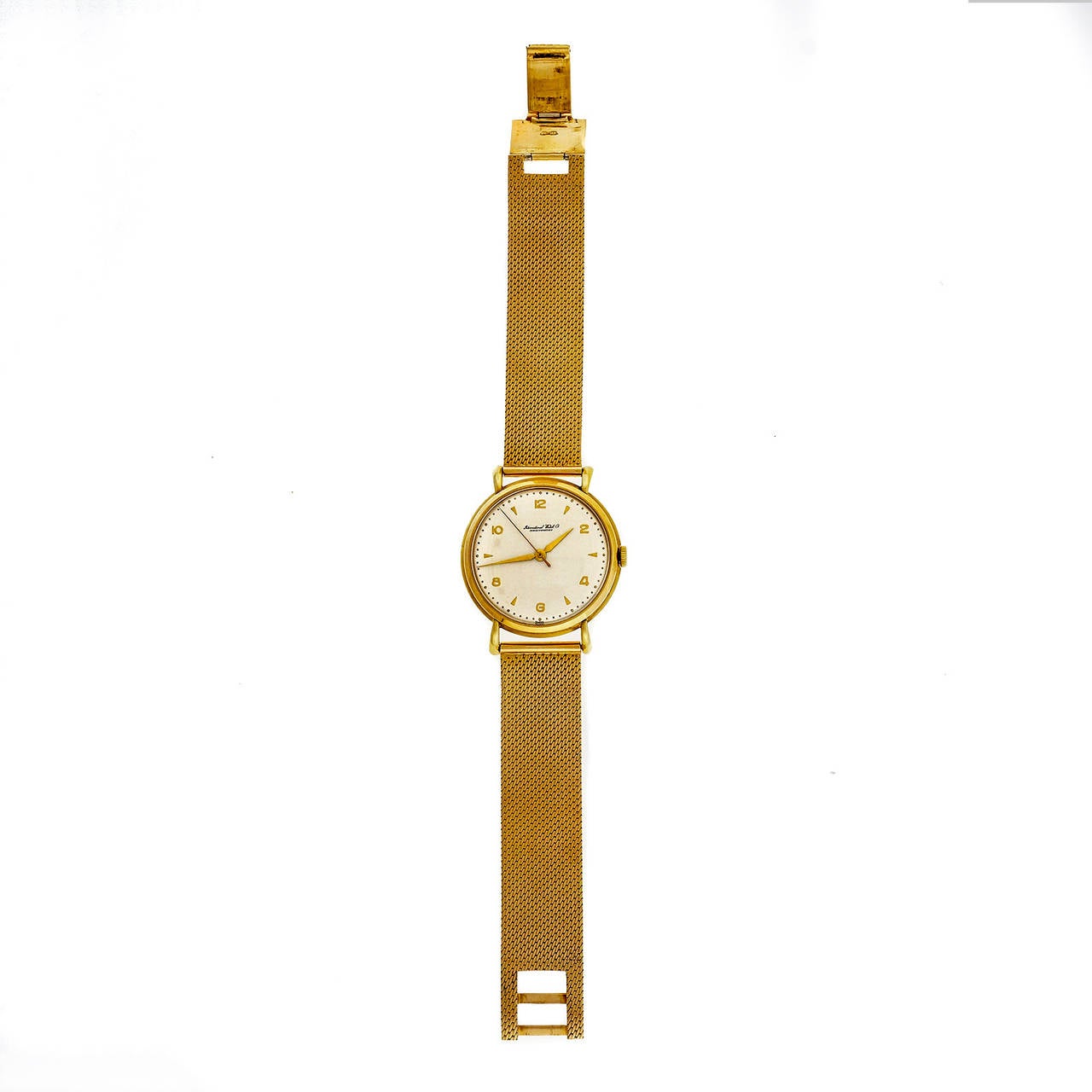 IWC yellow gold wristwatch with manual-wind movement and gold mesh band. Circa 1945.

18k yellow gold 
Length: 4.3mm 
Width: 36mm 
Bracelet length: 8 inches 
Bracelet width at case: 18mm 
Bracelet: 18k solid gold mesh stamped 750 
Case