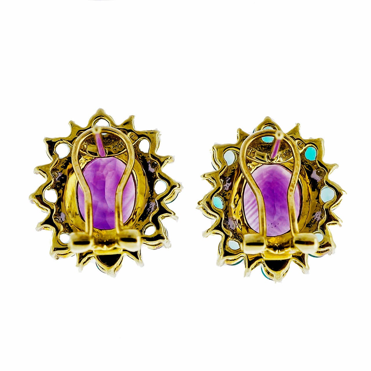 Classic and button style clip post earrings with bright color combination of Amethyst, blue Topaz and diamond. Circa 1980.

2 oval purple Amethyst, approx. total weight 4.80cts
16 round blue Topaz, approx. total weight 1.75cts, VS
16 round full