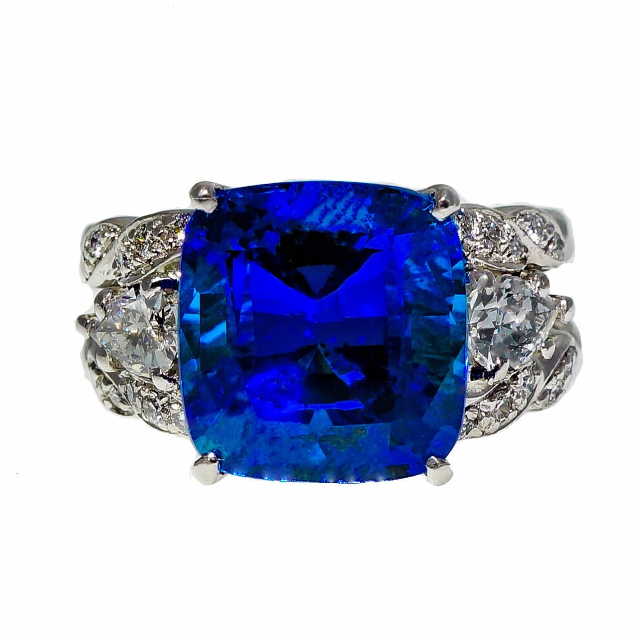 Tanzanite ring in exceptionally good condition. One of the finest we have ever seen. The ring dates to the early 1970’s. The color of the Tanzanite and family story are that this stone is from the original Tanzanite mine. Pure blue and extra bright.