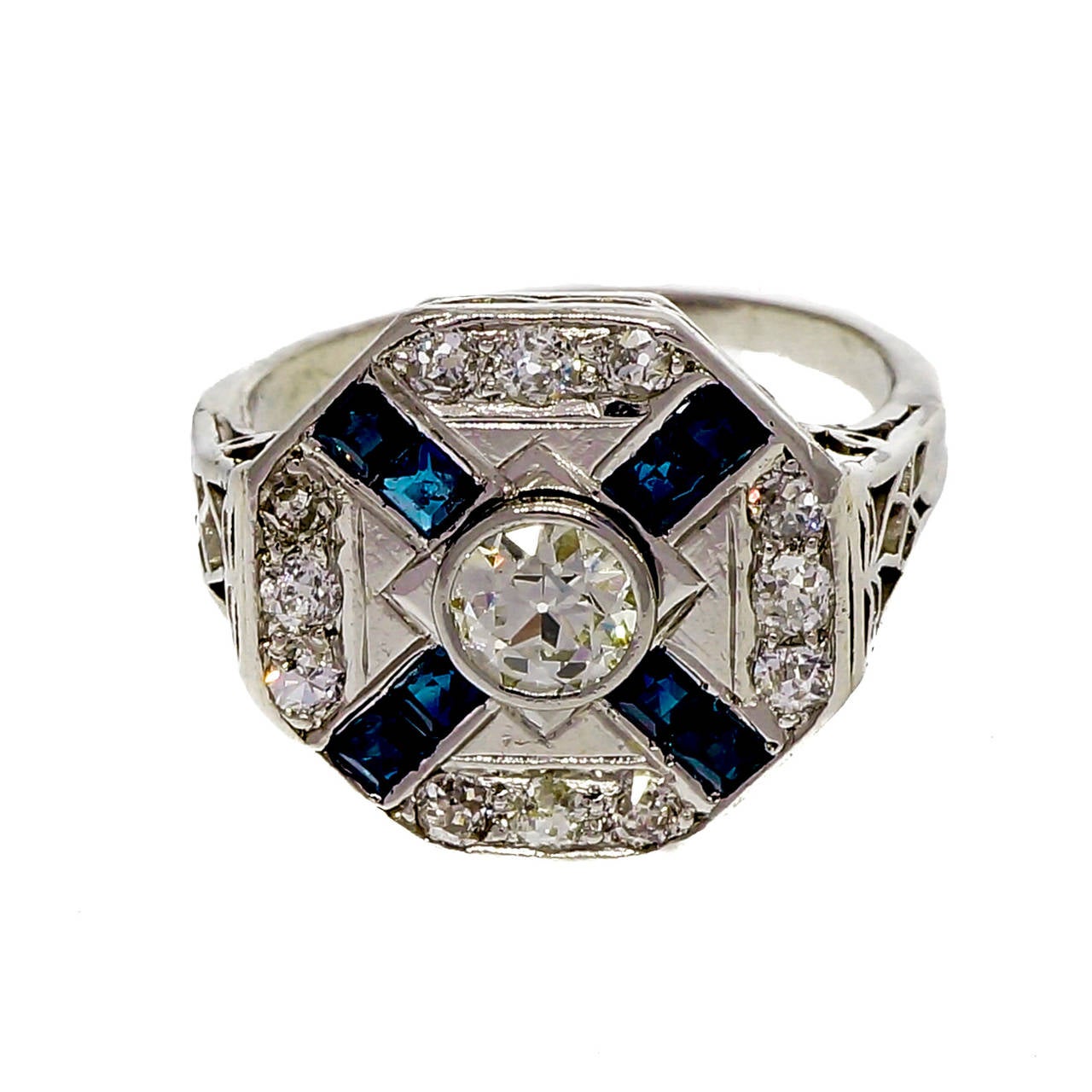 Original Art Deco 1920 octagonal ring with bright blue Sapphires set in an “X” with an original old European cut diamond center. EGL certified. Totally original. All handmade.

1 round old European cut diamond, approx. total weight .37cts, J, VS1,