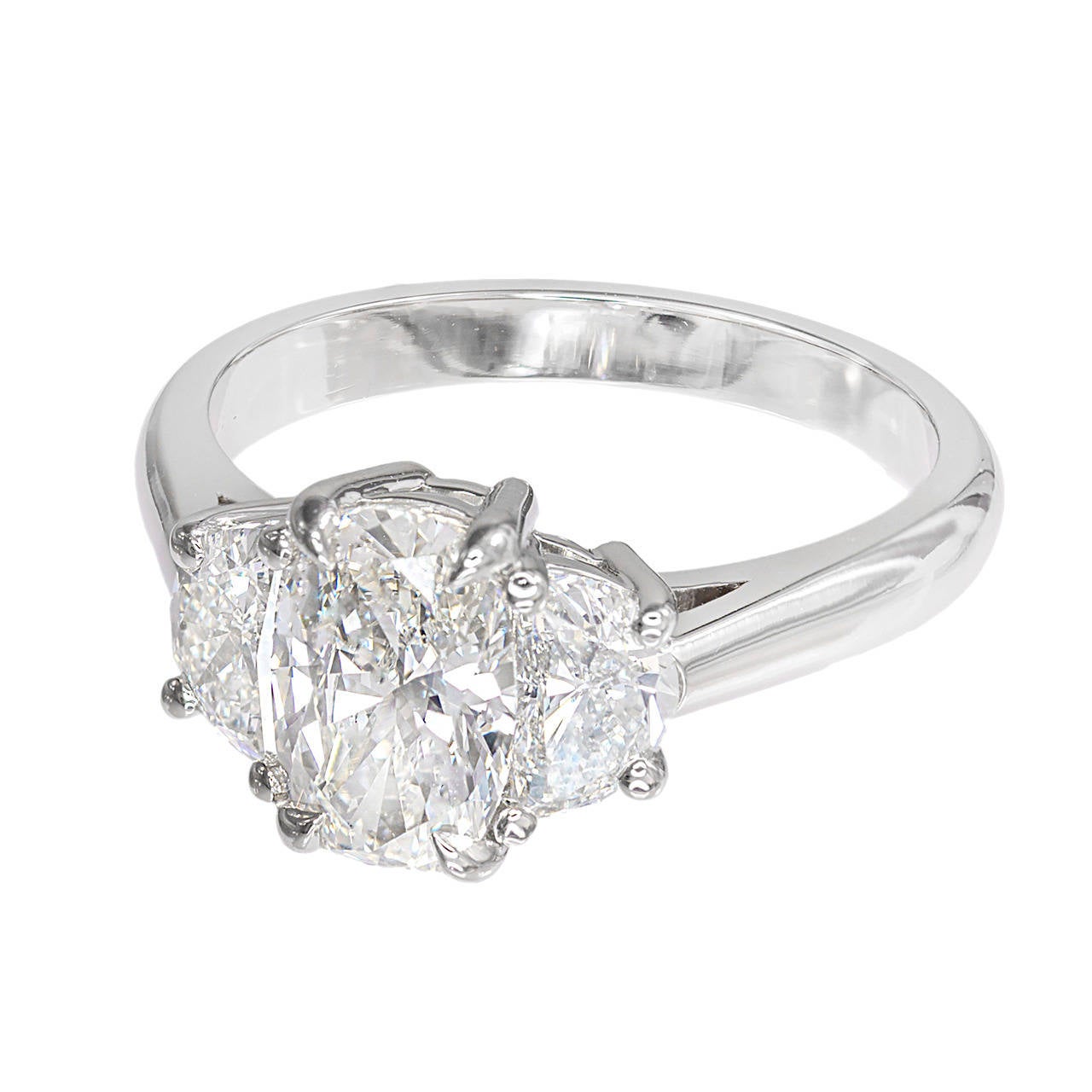 Bright sparkly elongated antique cushion cut diamond 1.09ct three-stone engagement ring.  The diamond is circa 1920-1930 and is matched with half-moon cut diamonds of the same quality from the same era. Setting was designed in the Peter Suchy
