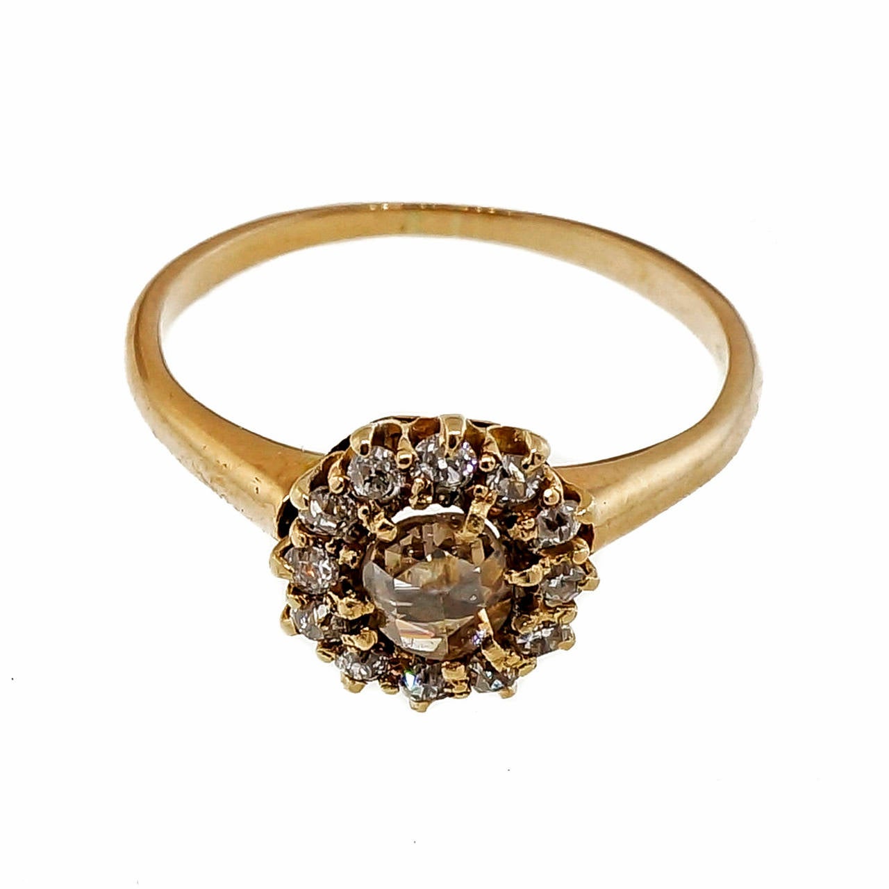 Victorian 1880 light brownish yellow and rose cut diamonds .28ct pink gold ring with old mine cut diamonds surrounding it. Just a hint of pink to the diamonds also.

1 rose cut diamond, approx. total weight .28cts, light yellowish brown (U-V), I1,