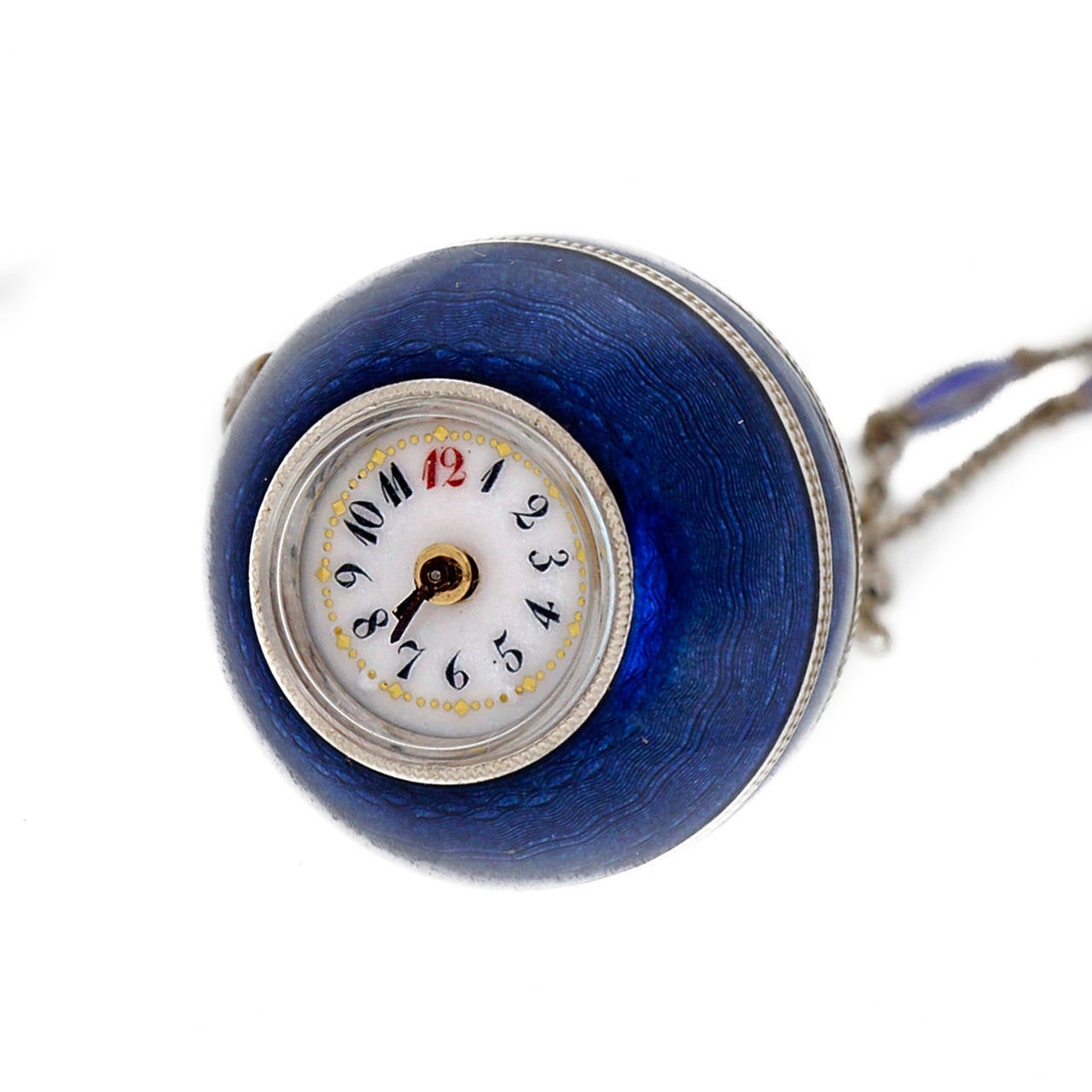Blue enamel ball watch necklace. Original blue enamel ball, circa 1890. Lever set on side. Winds by turning the bottom half of the watch. Porcelain enamel dial.

Silver
29.0 grams
Enamel
29.0 grams
24 inch silver chain with blue enamel bars and