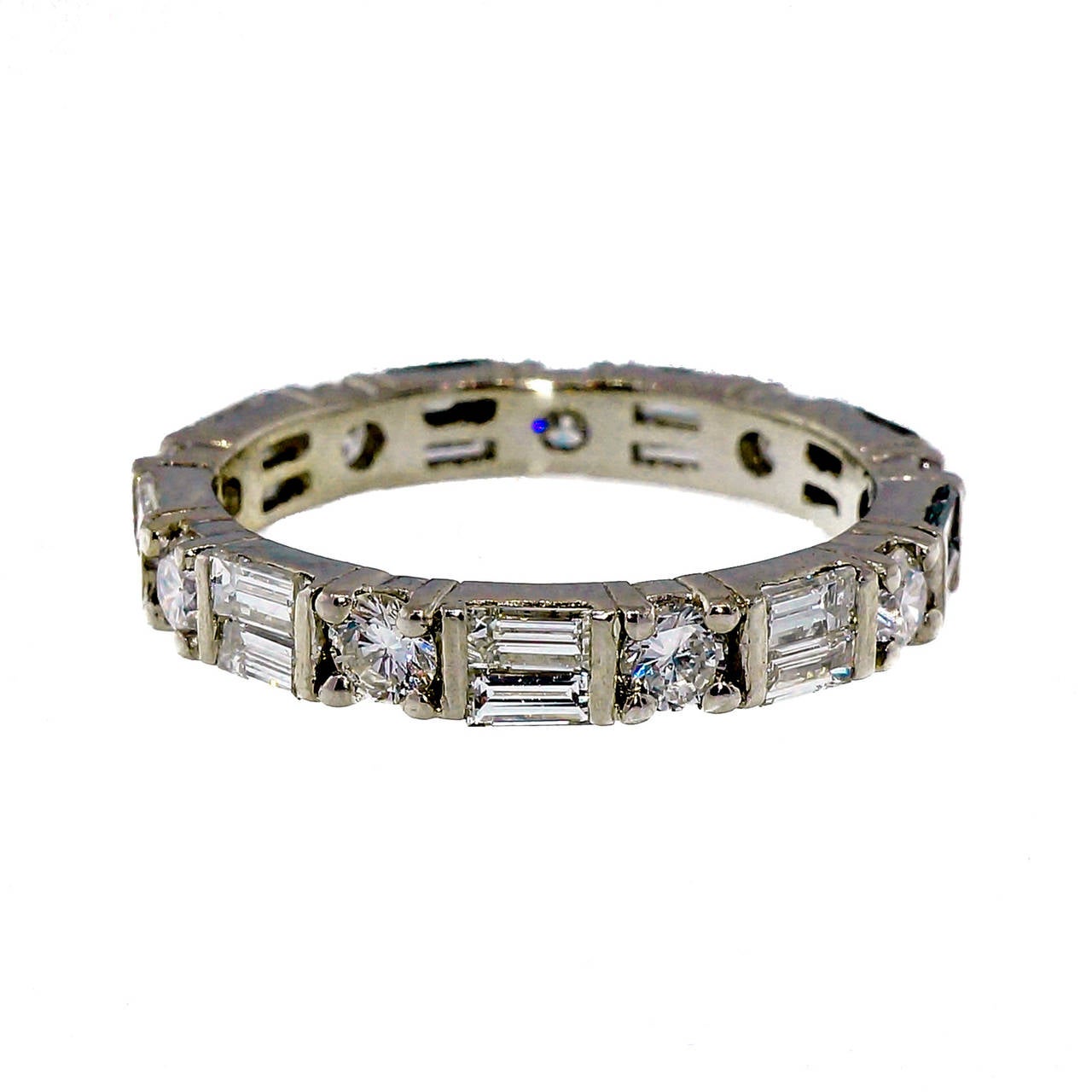 Clean crisp design wedding Eternity ring with 2 side by side baguette diamonds separated by one brilliant cut diamond all around.

18 baguette cut diamonds, approx. total weight 1.50cts, F, VS
9 round brilliant cut diamonds, approx. total weight