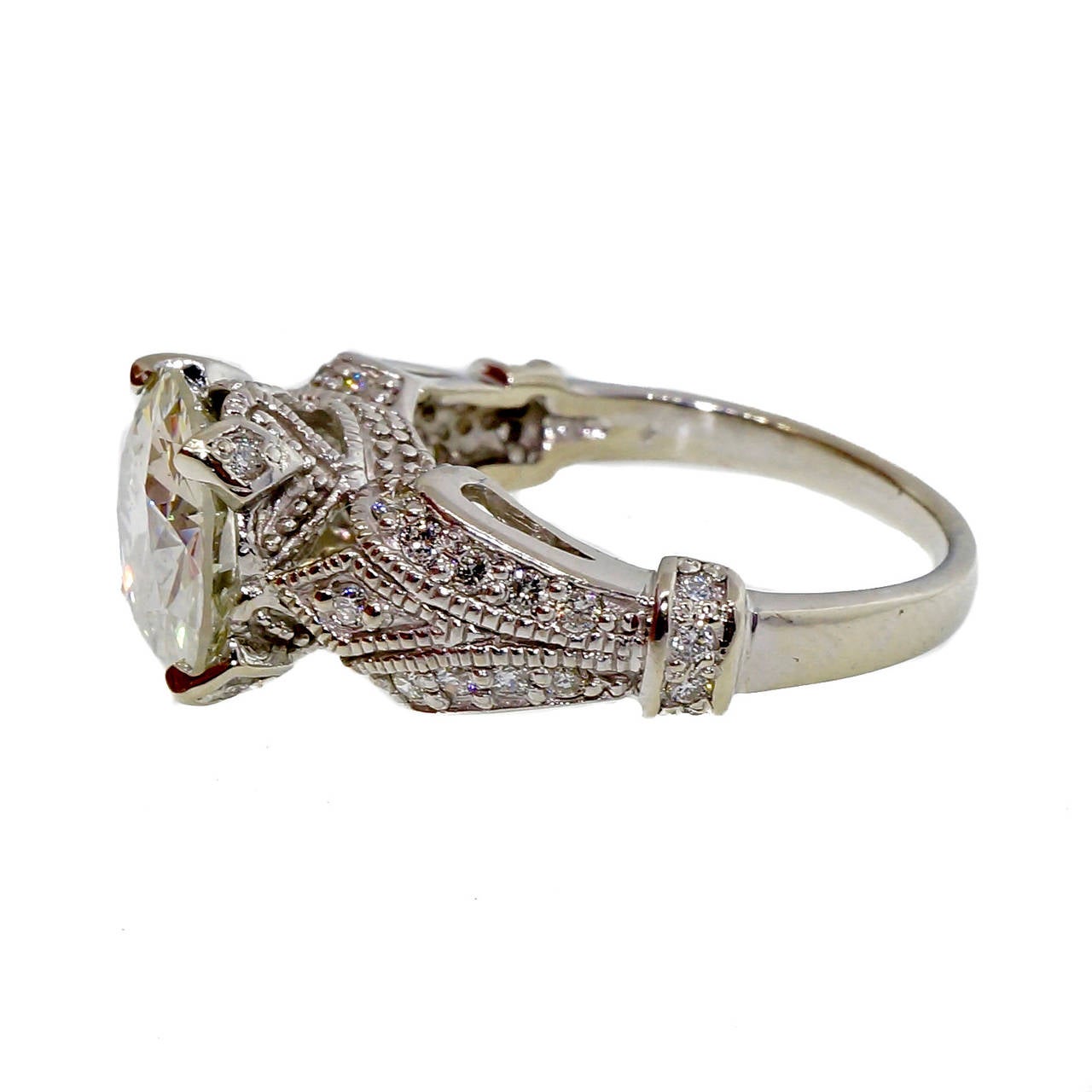 Transitional brilliant cut diamond original ring circa 1940. Cut with extra diameter and sparkle. Very nice crown style vintage setting. Bigger in diameter than most 3.00ct diamonds.

1 transitional cut diamond, approx. total weight 2.76cts, I,