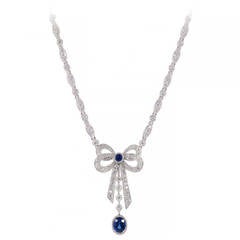 Oval Sapphire Pave Round Diamond Platinum Bow Pendant 10