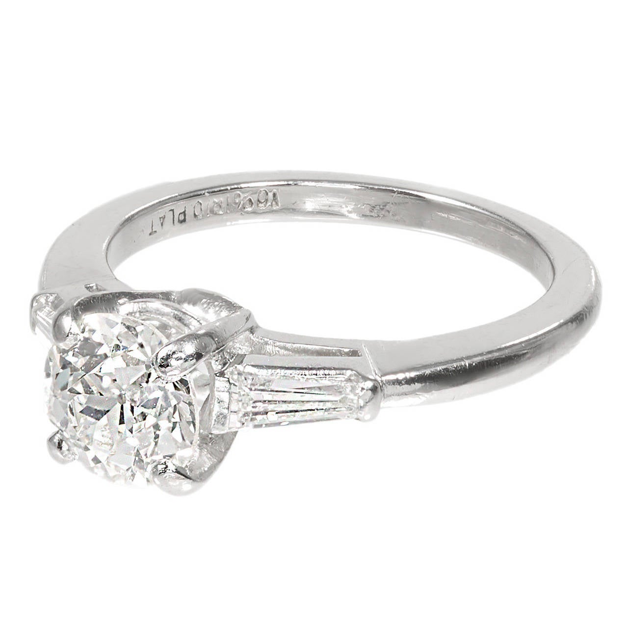 Old European cut diamond three-stone engagement ring. Excellent sparkle and face up color. Center diamond a platinum setting with two tapered baguette side diamonds. 

1 old European cut diamond, approx. total weight .90cts, L, VS1, 6.26 x 6.24 x