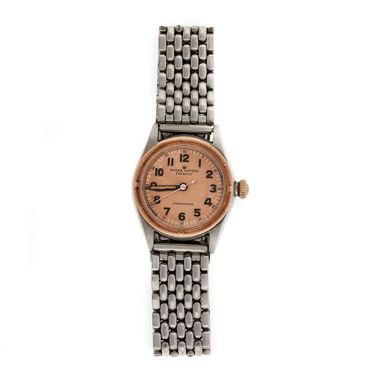 Stainless steel and 18k rose gold Rolex Firefly bubbleback, Ref. 3121, circa 1942,  28.5mm case with 18k rose gold bezel and crown. Rose dial. Steel grain-of-rice Rolex bracelet. Manual-wind movement.

Stainless steel and 18k rose gold
Length: