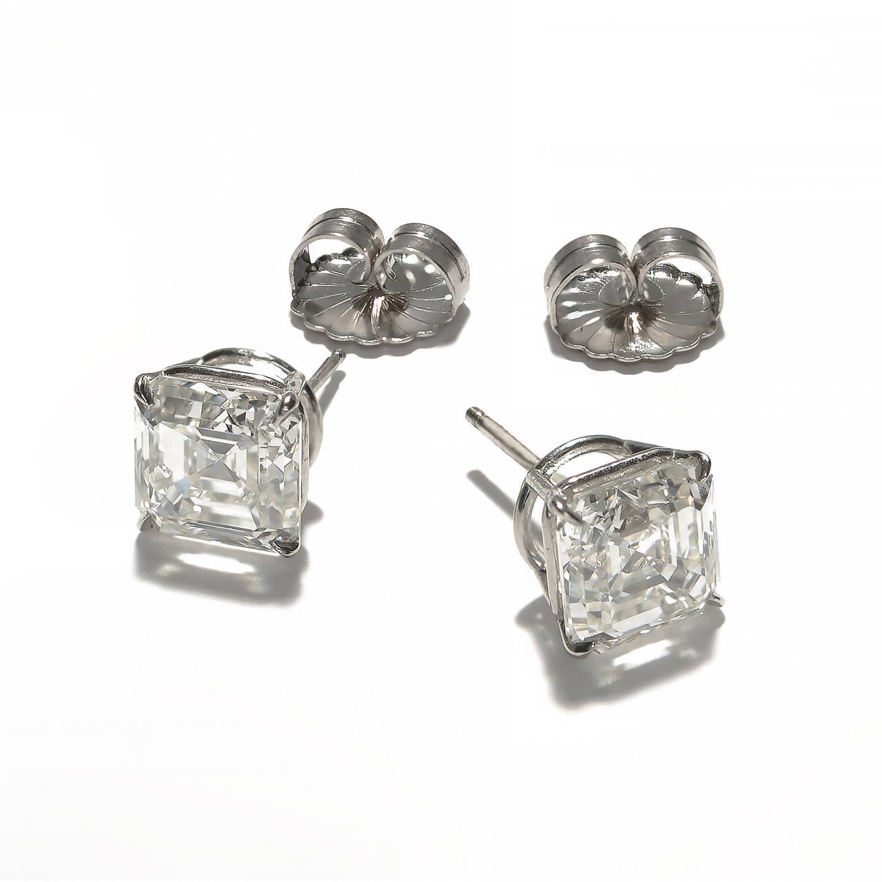 Matched GIA certified diamond studs with exceptional sparkle and presence in simple platinum four prong settings. 8.15ct total weight. Perfectly matched. Probably cut to match. 4.06 and 4.08ct, both I color and face up white.  Both VS, clarity.