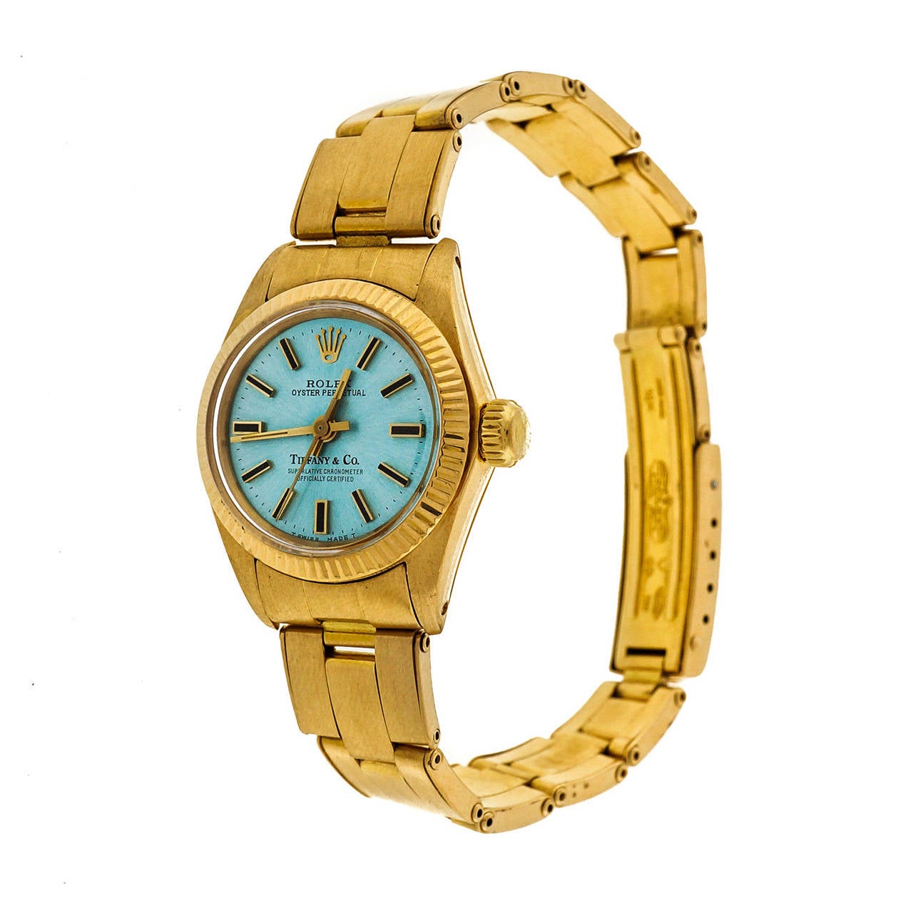 Vintage 1969-1970 Tiffany & Co 18k yellow gold Oyster Perpetual watch model 6719 retailed by Tiffany & Co with its original 18k gold rivet Oyster band by Rolex in excellent condition. Professionally refinished custom color bright ice blue dial.The
