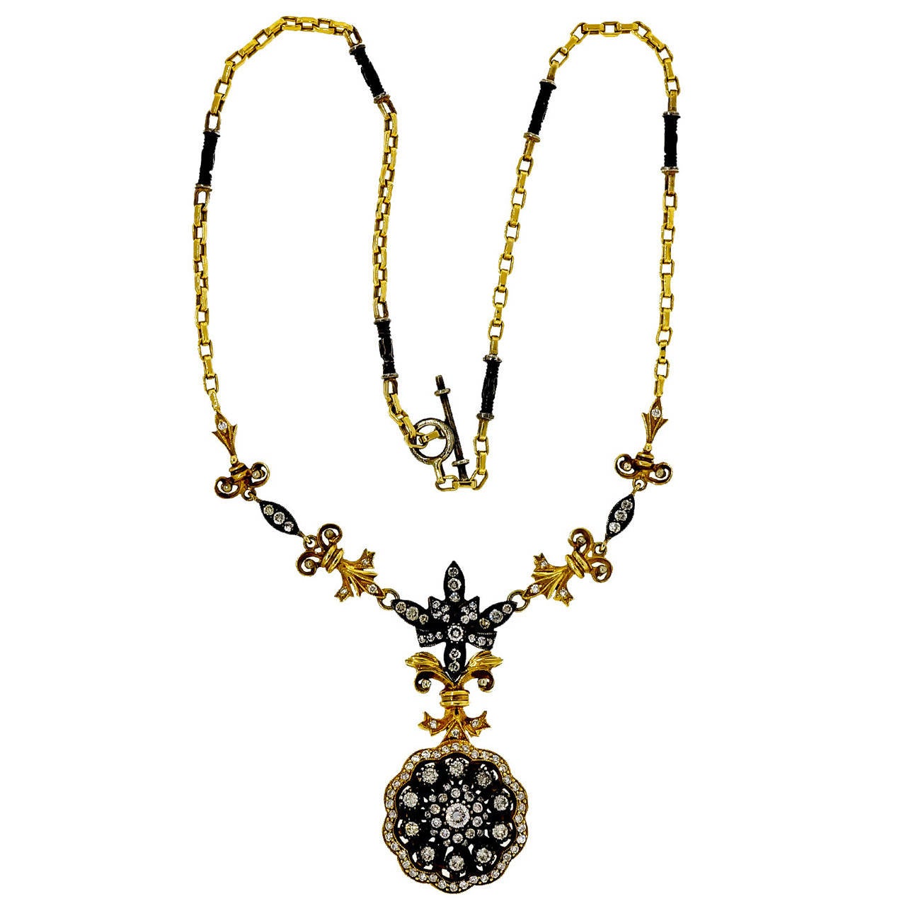 Eutruscian style pendant necklace in 18k yellow gold and blackened silver and brown diamonds accents. 

Approximately 100 round diamonds, approx. total weight 2.60cts, J-K-L, SI
18k yellow gold and silver
29.0 grams
Tested: 18k and silver
Stamped: