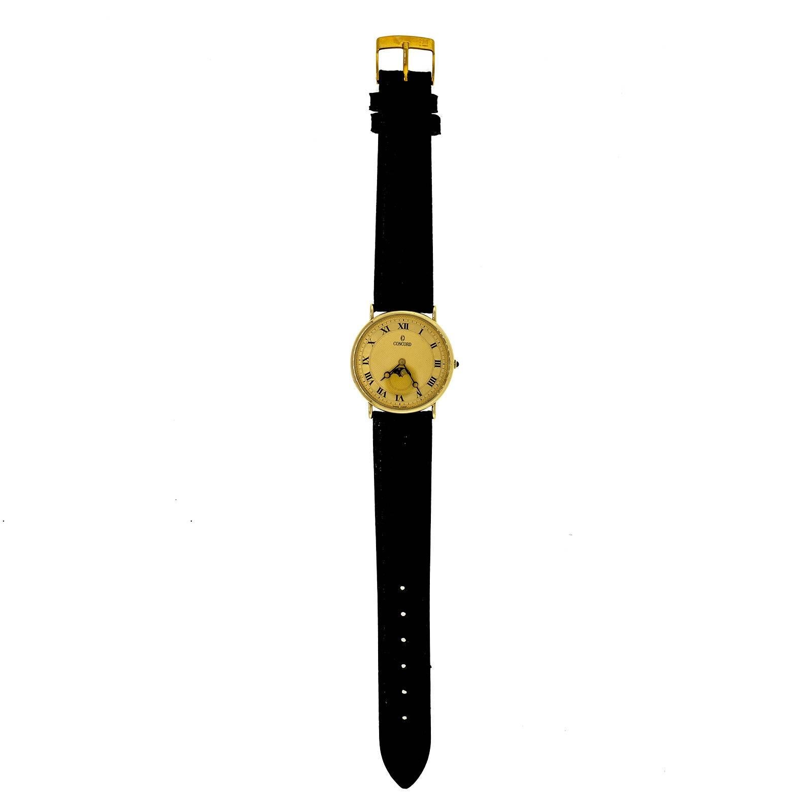 Concord Moonphase 14 karat yellow gold ultra-thin quartz. 

14k Yellow gold
24.4 grams
Length: 35.05mm
Width: 30.00mm
Band width at case: 18mm
Case thickness: 4.53mm
Band: New genuine Lizard made in Italy with minor showcase wear
Crystal: