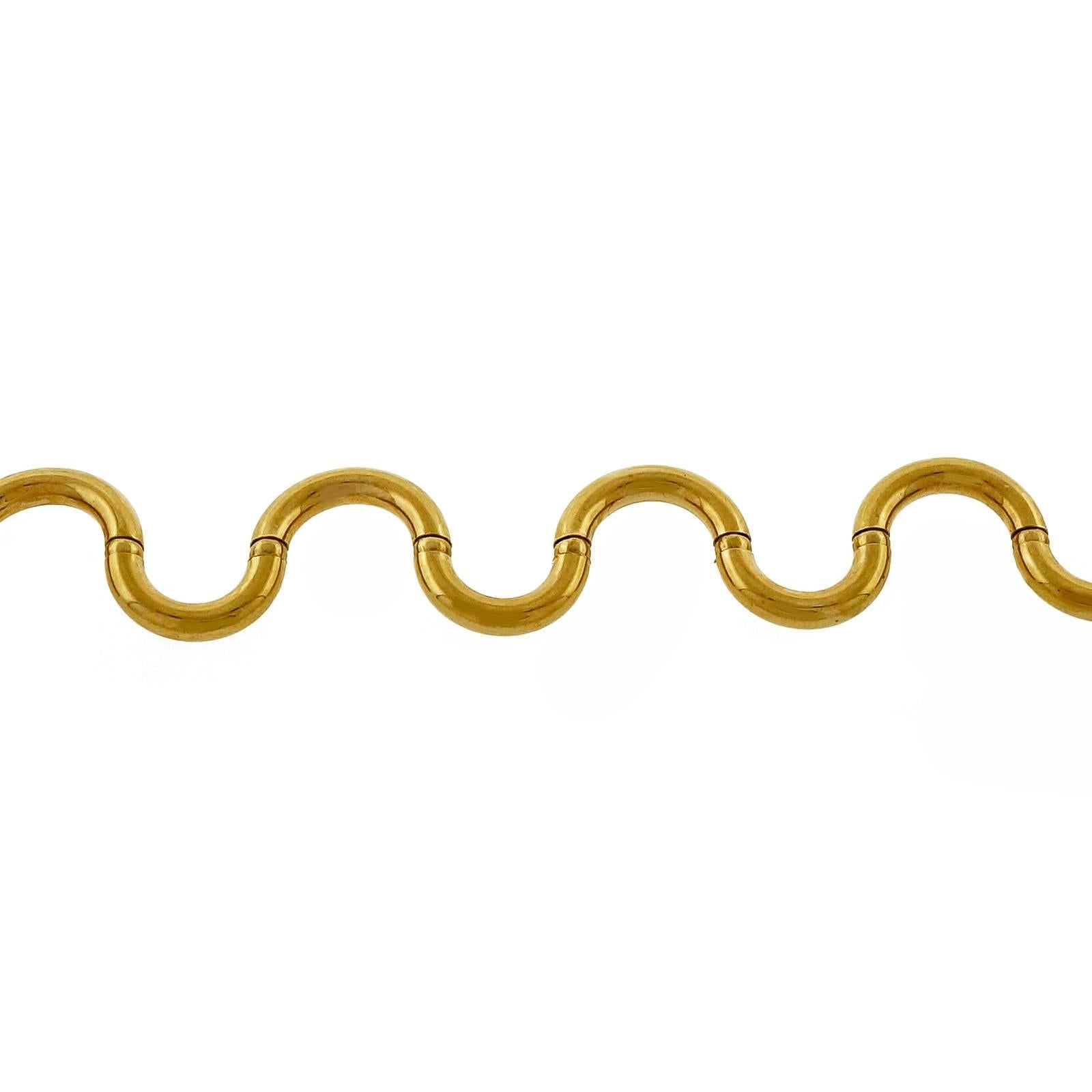 UNOAERRE 1970's Italian unique Brev swirl hinged link necklace, 16 inches long, circa 1970-1980.

18k yellow gold
26.7 grams
Tested: 18k
Stamped: 750
Hallmark: BREV
Length: 16 inches – Width: 6.10mm – Depth: 3.19mm
