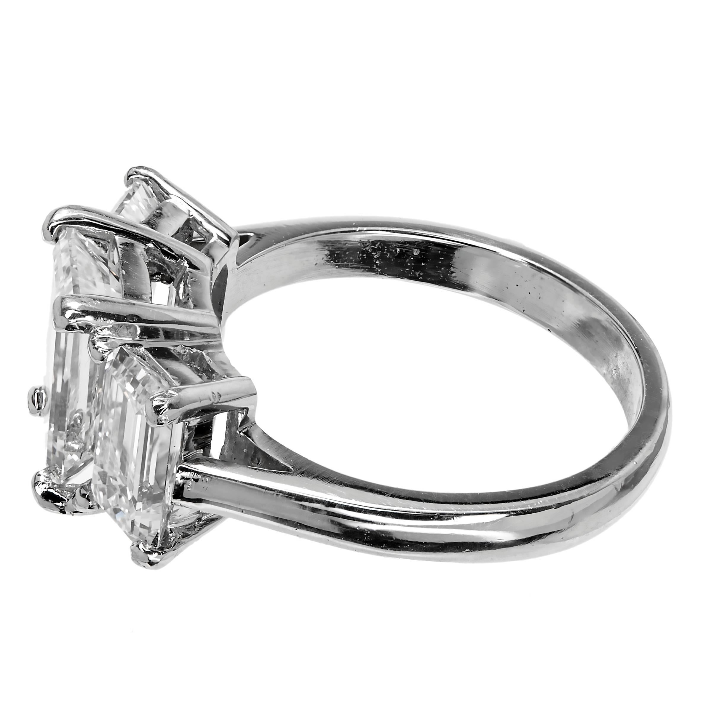 Emerald cut 3 stone well matched diamond ring. All GIA certified. All D to E color. All VS1. Handmade solid Platinum setting. The ring is brand new and handmade from the Peter Suchy Workshop PSD.

1 Emerald cut diamond, approx. total weight