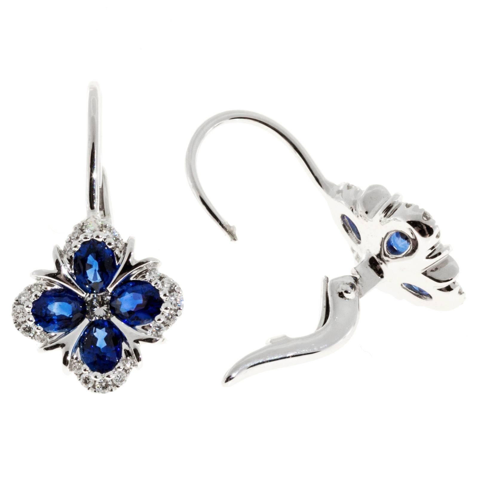 Designer Spark blue Sapphire and diamond Euro wire earrings.

8 oval fine blue Sapphires, approx. total weight 1.84cts
42 round diamonds, approx. total weight .30cts, F, VS
18k white gold
Tested and stamped: 18k
Hallmark: Spark
5.2 grams
Top