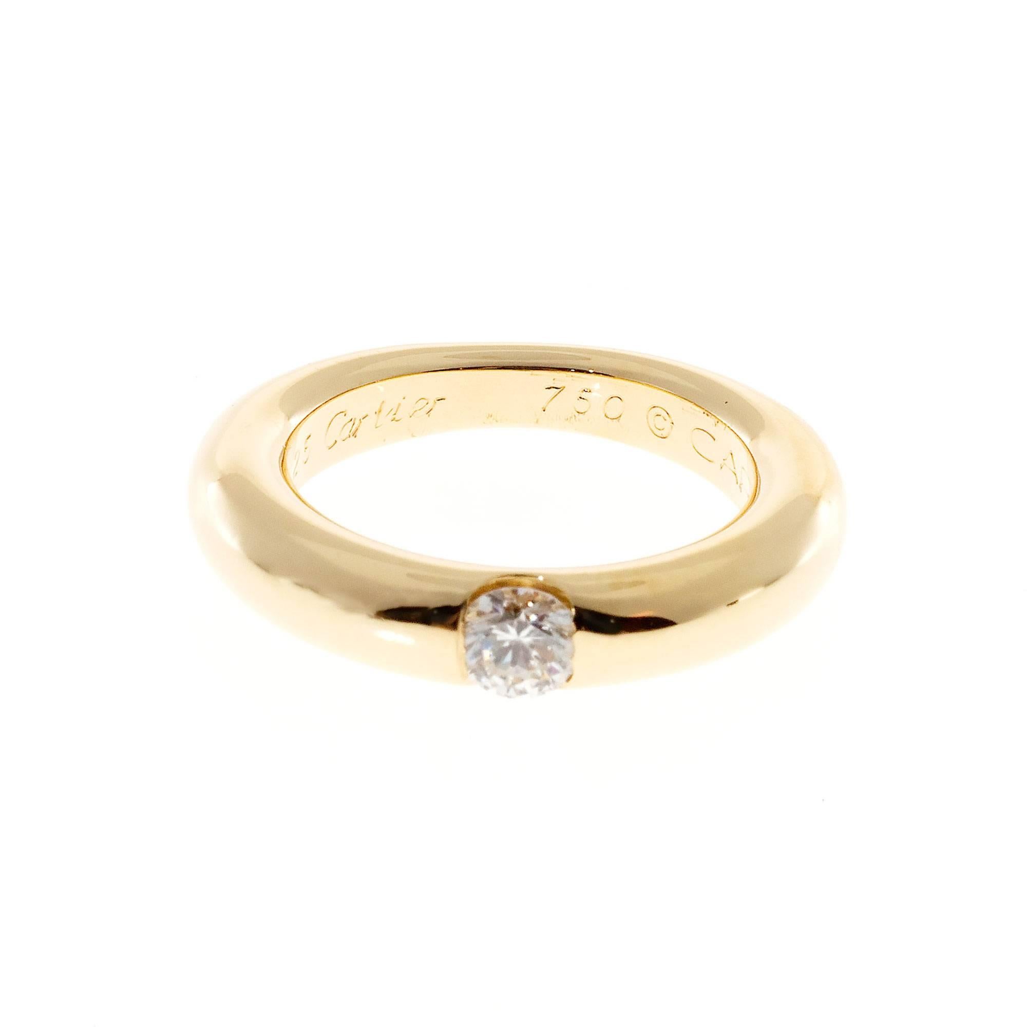 Cartier Ellipse .25ct diamond solid 18k yellow gold ring.

1 round diamond, approx. total weight .25cts, F, VS1
18k yellow gold
Tested: 18k
Stamped: 750
Hallmark: © Cartier 1993 48 48 DP 0.25
8.5 grams
Size 4.75 and not easily sizable
