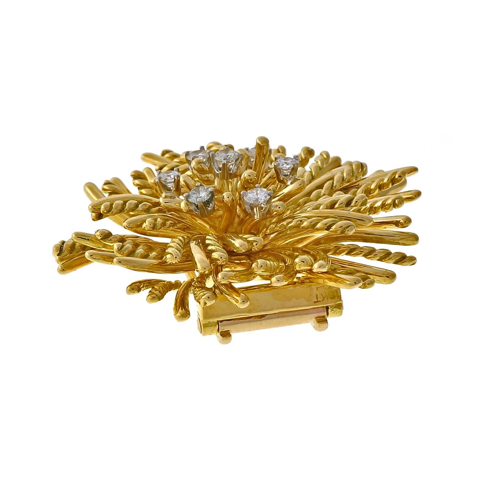 Authentic Tiffany & Co Anemone 18k yellow gold diamond double clip pin. 

7 round diamonds, approx. total weight .50cts, F, VS
18k yellow gold
Tested and stamped: 18k 
Hallmark: 5004 Tiffany & Co23.6 grams
Top to bottom: 37.81mm or 1.49 inches