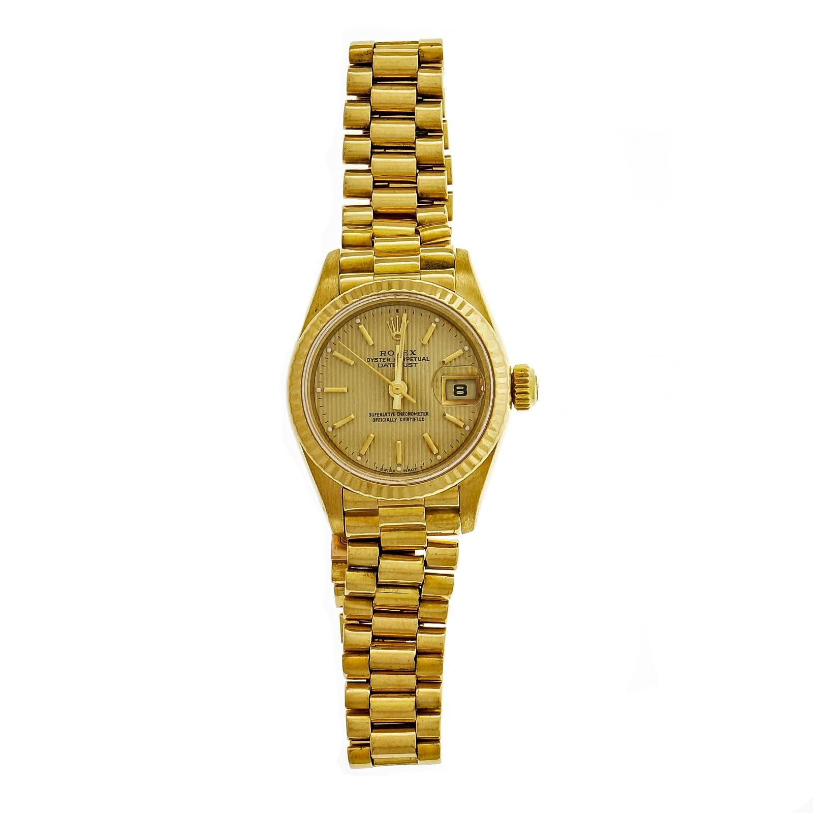 Ladies Rolex President with gold tone pin stripe dial and Presidential band. Model 69178. Band shows moderate stretch but fully wearable. Circa 1990.

18k yellow gold
Strap length: 6 7/8 inches 
71.3 grams 
Length: 35mm 
Width: 26mm 
Band