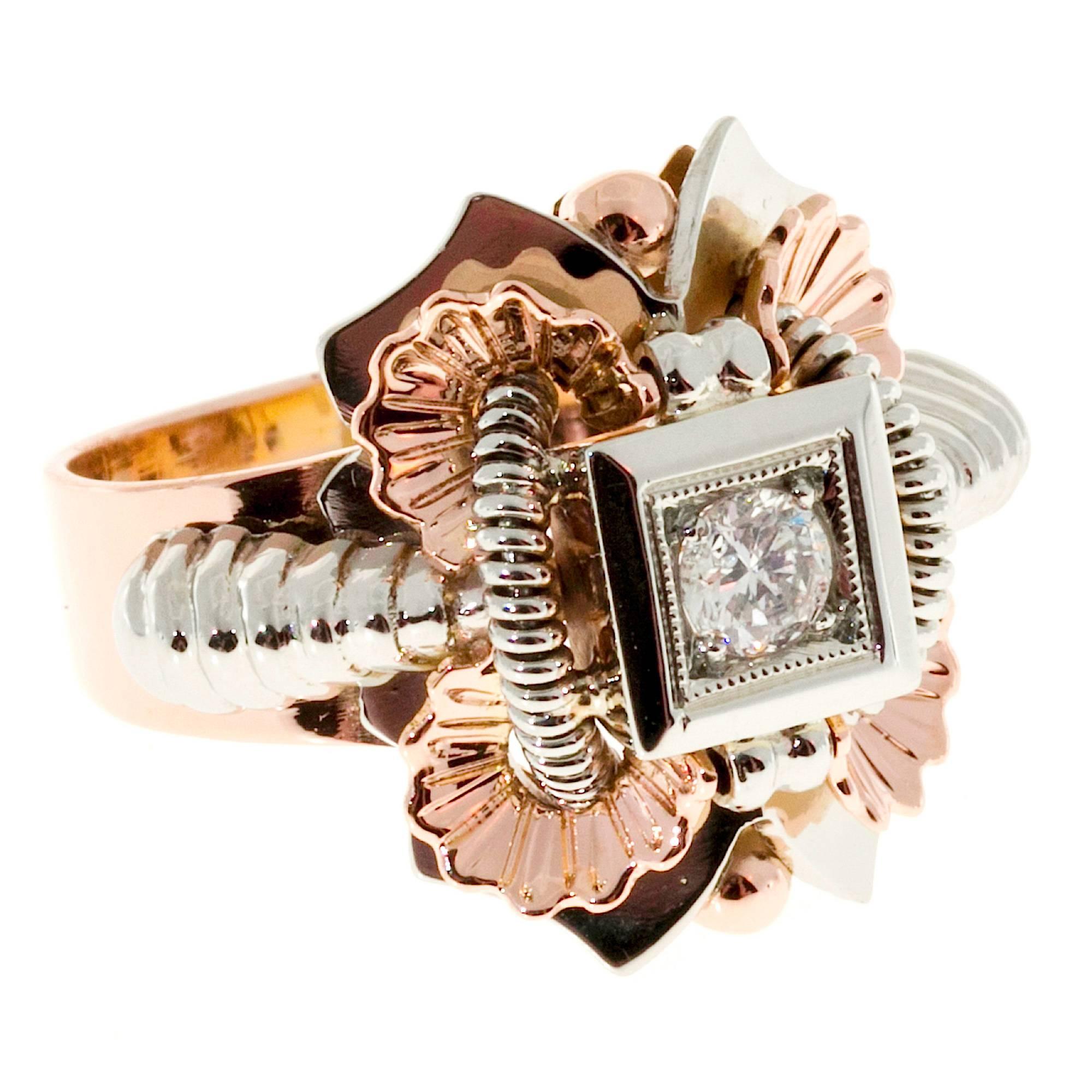 Retro Italian handmade 18k rose and white gold ring circa 1940 with a fine bright full cut diamond.

1 full cut diamond, approx. total weight .18ct, G, VS
18k white and rose gold
Tested: 18k
Stamped: 750
Hallmark: 636Al
6.9 grams
Width at