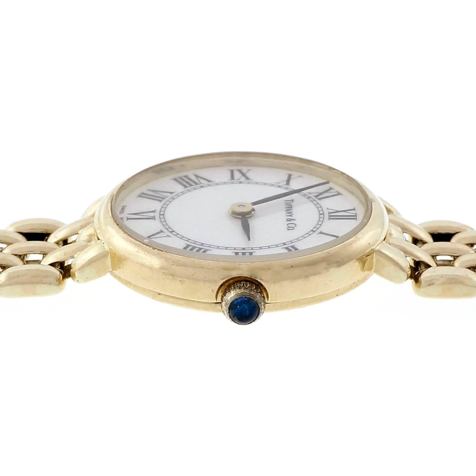  Ladies Tiffany & Co solid 14k yellow gold mesh watch with white dial and black Roman numerals.

14k yellow gold 
Length: 20.5mm 
Width: 20.5mm 
Band width at case: 10.5mm 
Case thickness: 4.63mm 
Band: 14k gold mesh stamped 585 CHI