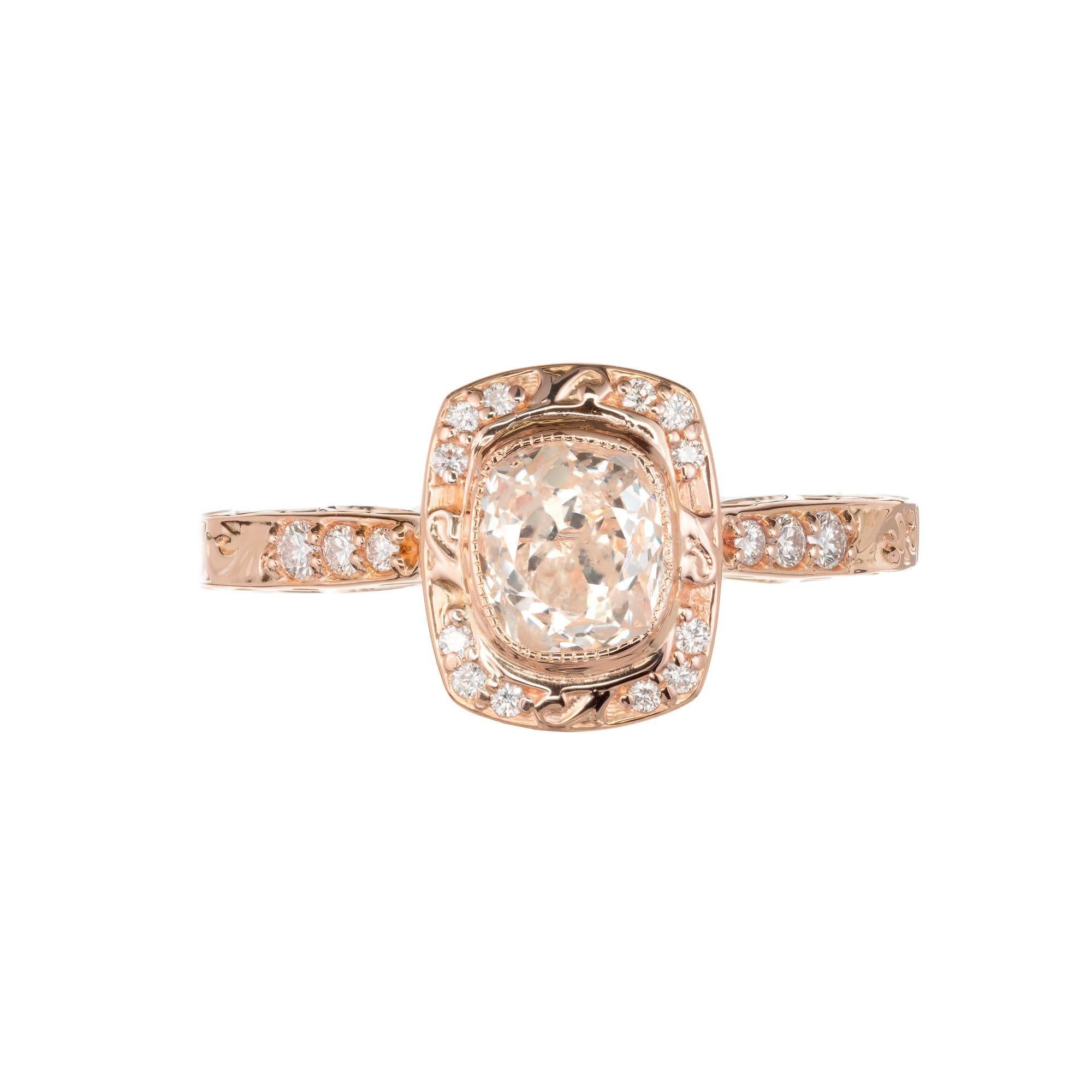Peter Suchy scroll cushion bezel set simple halo diamond engagement ring. Scroll shoulders and sides. 18k rose gold setting which a wedding band can sit flush to the ring. The stone is from the late 1800's, old mine brilliant cut cushion shape with