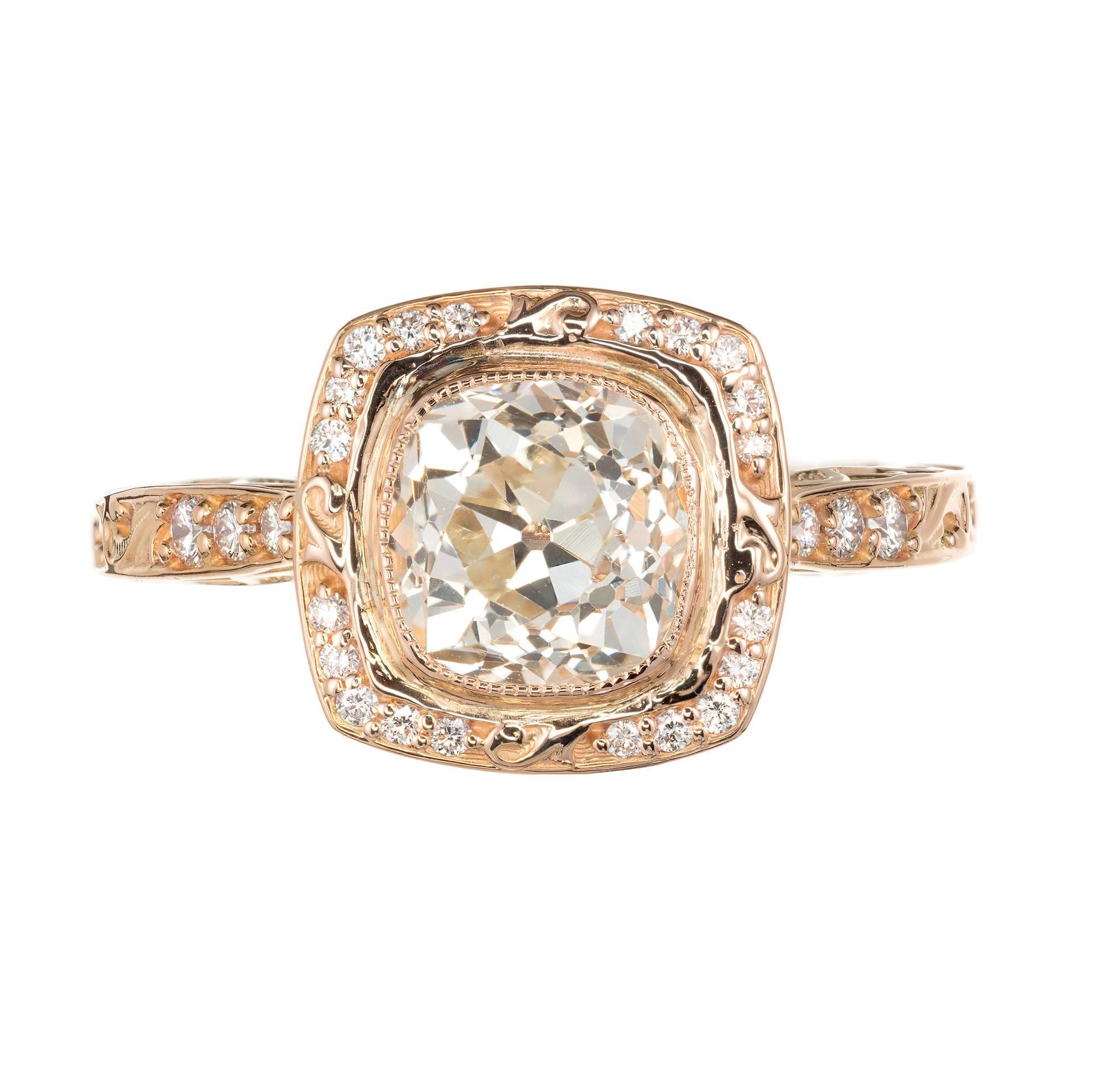 Peter Suchy  square scroll cushion bezel set, simple halo design engagement ring with scroll shoulders and sides. 18k rose gold setting with diamond accents. A wedding band can fit flush to the ring. Old mine brilliant cut squarish cushion cut