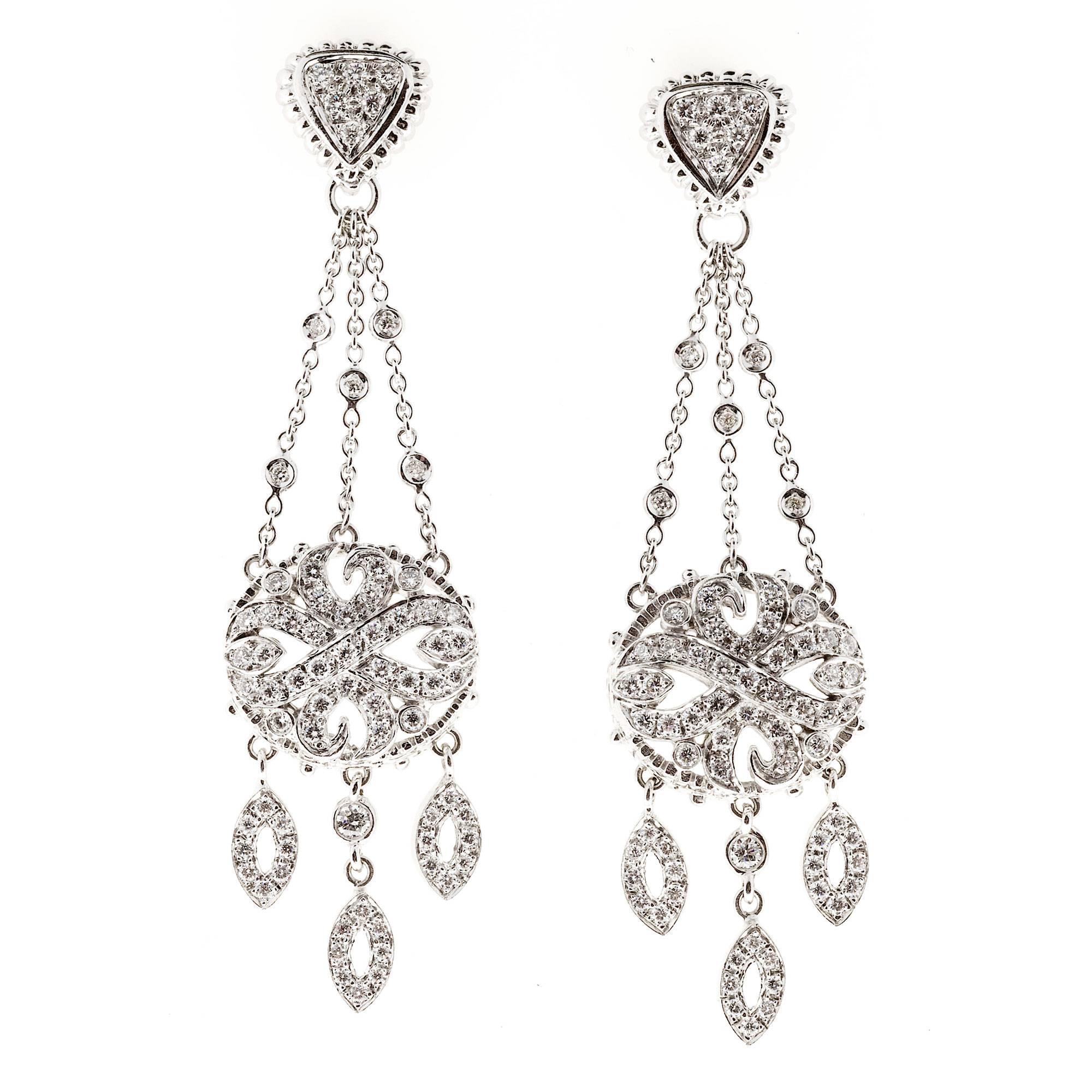 Authentic dramatic original Doris Panos 18k white gold Chandelier earrings with a beautiful 3 dimensional design. Excellent condition. Looks great on the ear.

142 round full cut diamonds, approx. total weight 2.00cts, F to G, VS, bright and