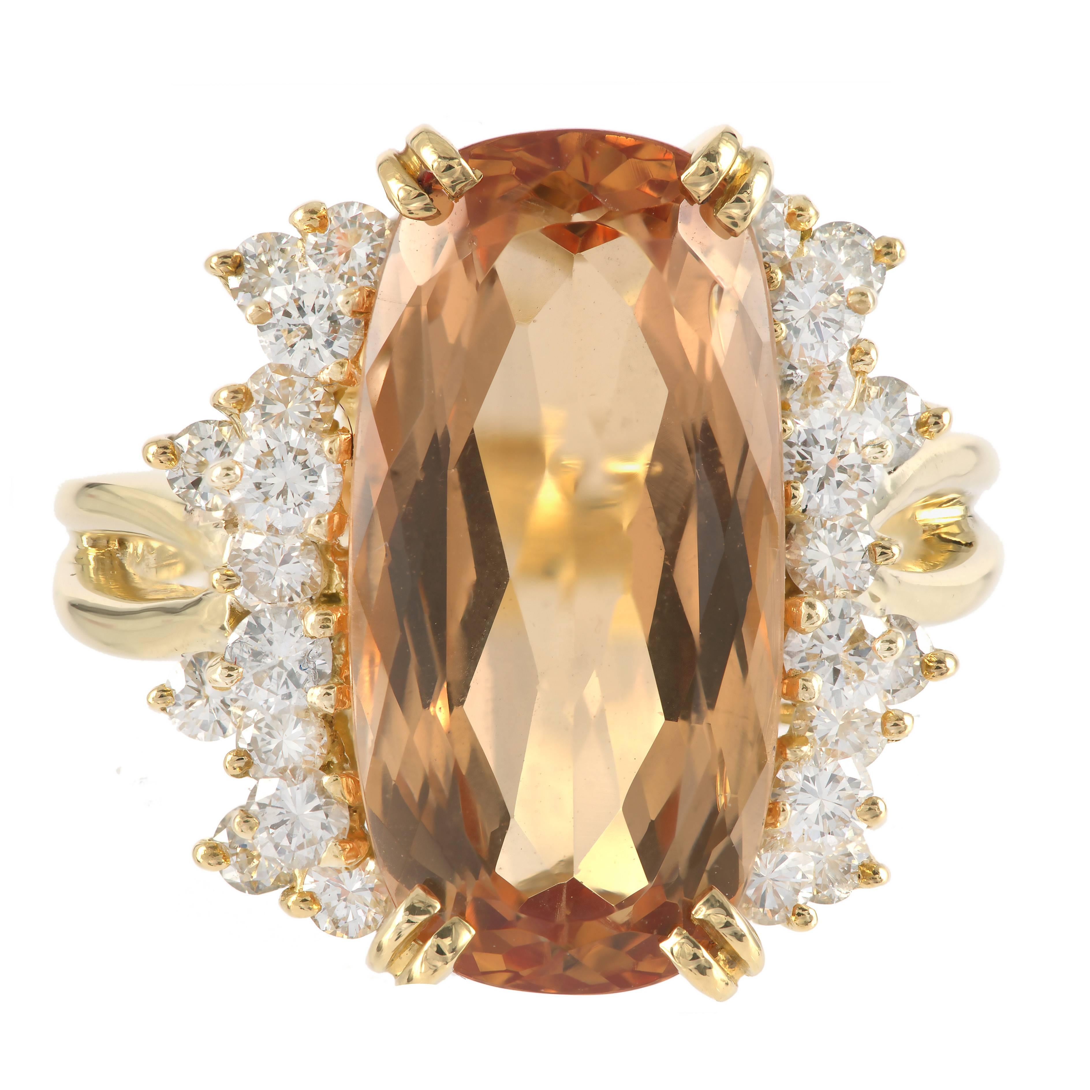 Elongated cushion shape GIA certified natural untreated orange precious Topaz in a numbered 18k yellow gold ring with bright sparkly diamonds. The Topaz has rolling sparkle with a slightly deeper color at the long ends. Circa 1960.

1 cushion