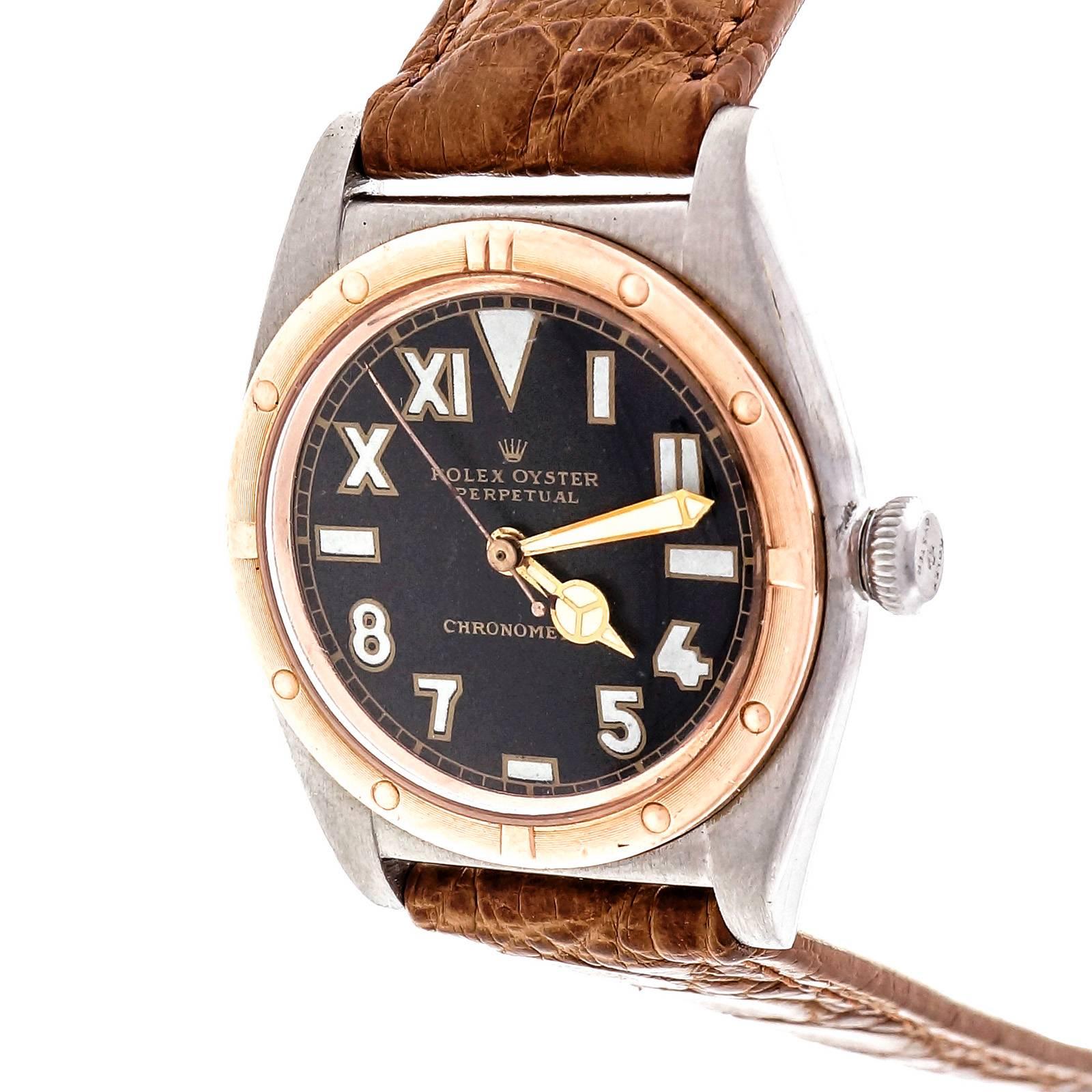 Rolex bubble back 1944 with deep pink, almost red, gold bezel and beautiful black dial with mixed Roman numerals and numbers. The dial is either original or an early authentic Rolex service dial on an early expert refinish job. 

Rose gold and