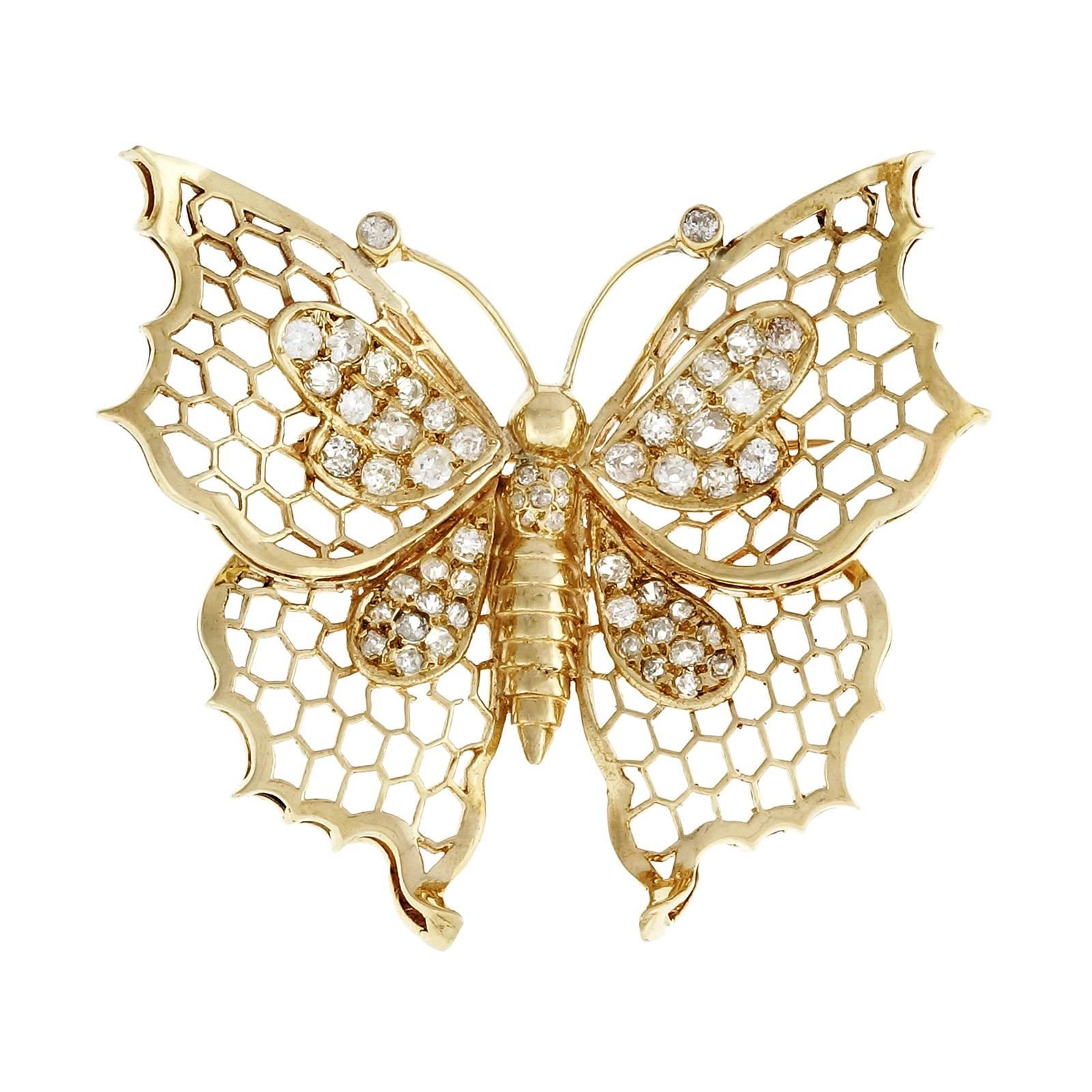 Open work 1930's Butterfly diamond brooch. 55 old mine cut diamonds in a a 14k yellow gold butterfly. 

55 old mine cut diamonds, approx. total weight 1.50cts, J – K, SI
14k yellow gold
Tested: 14k
15.5 grams
Top to bottom: 48.94mm or 1.93