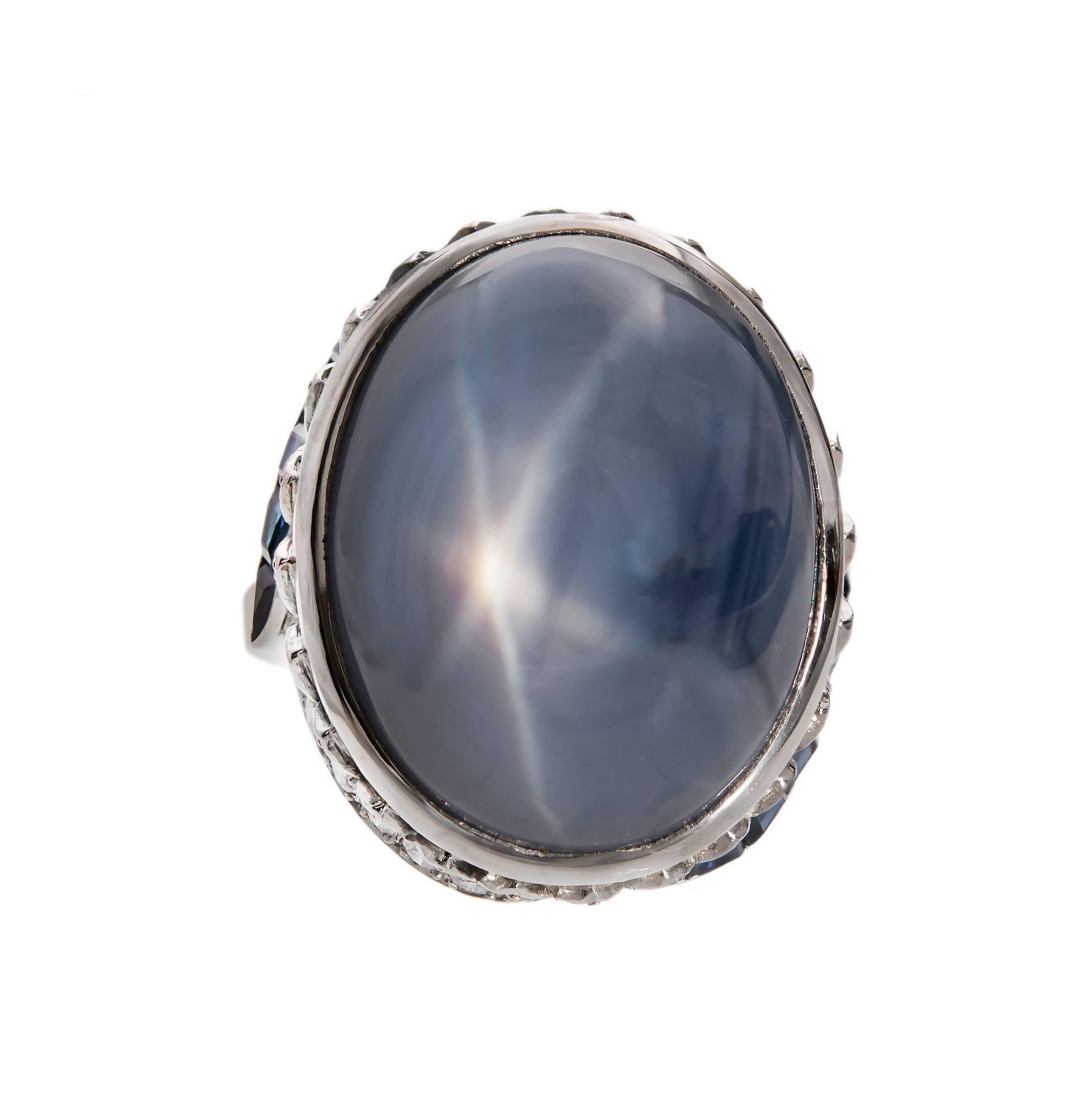 Large 1940-1950 medium blue Sapphire cabochon. Full cut diamonds and custom cut Sapphires.

1 oval blue cabochon star Sapphire, approx. total weight 52.50cts, no heat, 20.50 x 16.06 x 15.64mm, GIA certificate #2171534348
50 round full cut diamonds,