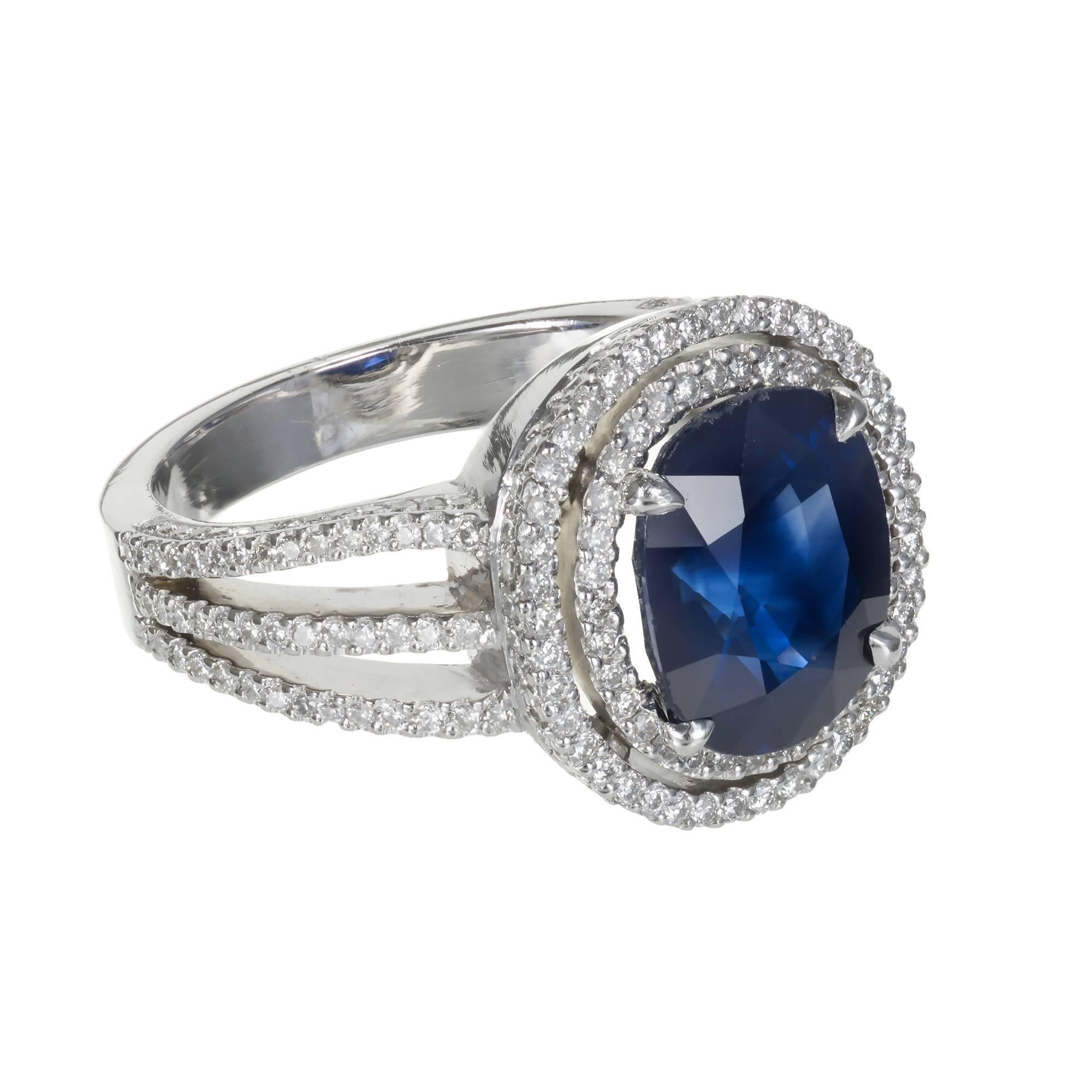 Cushion Royal blue Sapphire and diamond engagement ring.  GIA certified natural corundum simple heat only no other enhancements. Handmade Platinum ring with 160 diamonds. double halo top, triple shank. Circa 1950.

1 cushion cut gem Royal blue