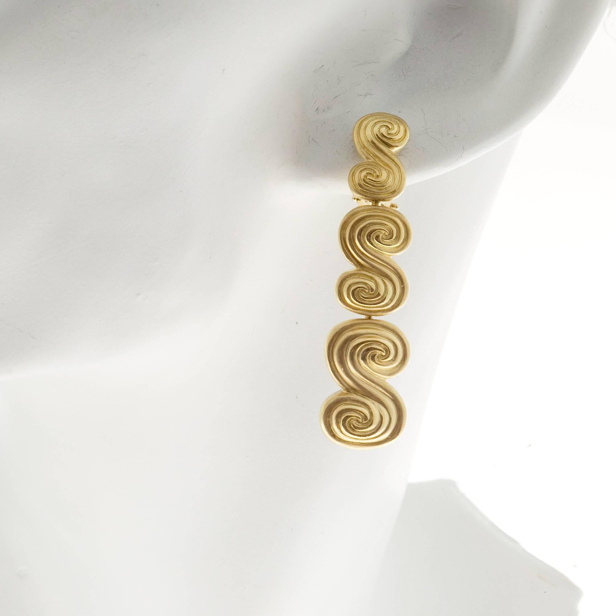 gold swirl earrings