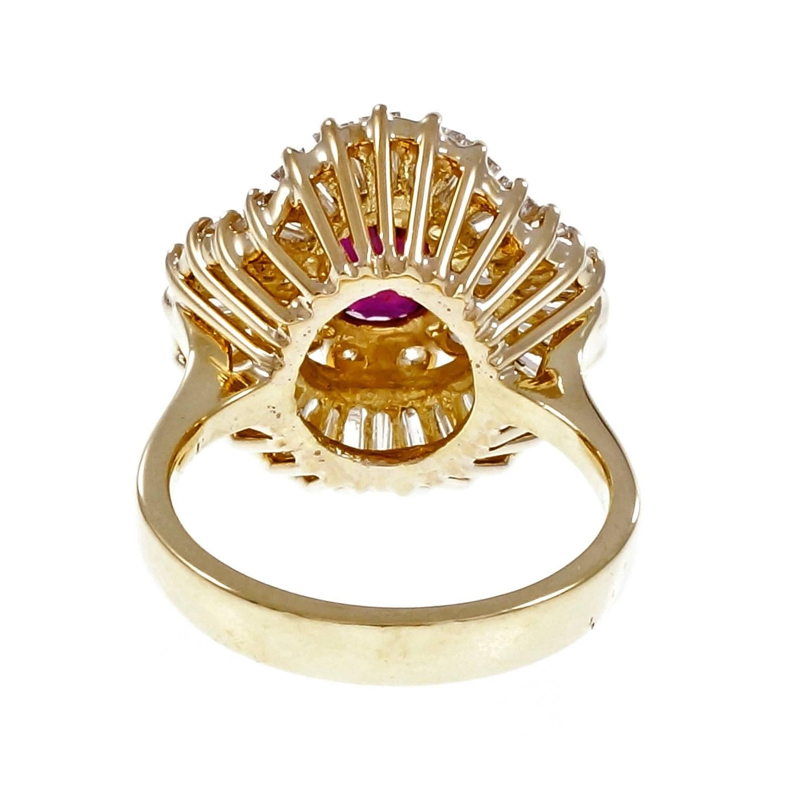 1960’s Ruby Diamond Gold Ballerina Cocktail Ring. Ballerina style handmade 18k yellow gold ring with a vivid bright red Ruby GIA certified natural simple heat only. Bright white baguette and round diamonds.

1 oval red Ruby, approx. total weight