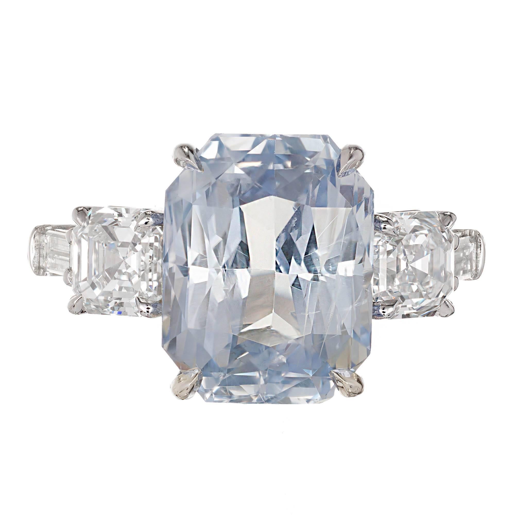 Peter Suchy light blue sapphire diamond platinum engagement ring. All the center stones are GIA certified. The center sapphire has top to bottom brightness and light to medium violet blue color. The side diamonds are original asscher cut diamonds.