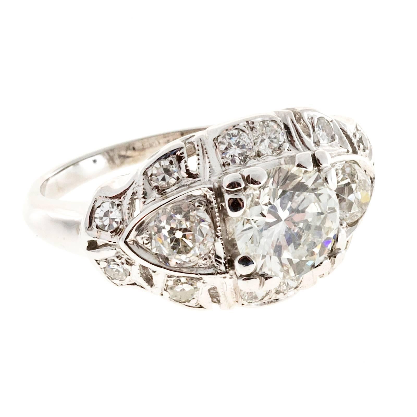 1940s 1.10ct Diamond 14k white gold engagement ring with white diamond accents. . 

1 transitional brilliant cut diamond, approx. total weight 1.10cts, G-H, SI2  Depth: 60.1%  Table: 63%, 
8 single cut diamonds, approx. total weight .10cts, F-G, VS