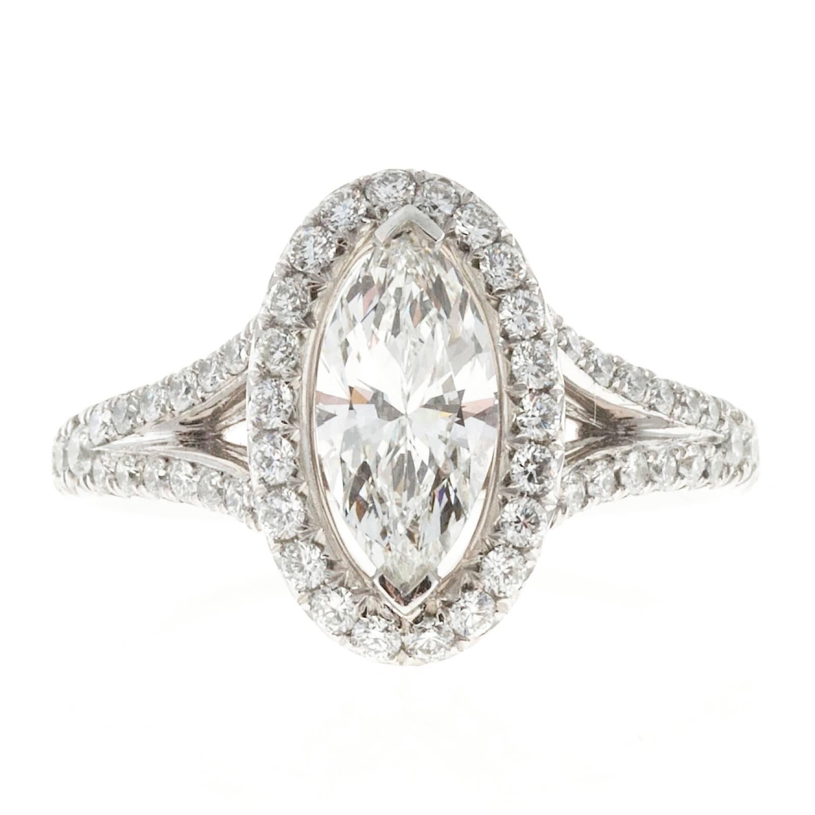 Pete Suchy Ideal cut Marquise diamond engagement ring 0.99ct in a custom design split platinum diamond shank with with an oval Halo of diamonds. GIA certificate # 6157172225

1 Ideal Marquise diamond, approx. total weight .99cts, H, SI1, Depth: