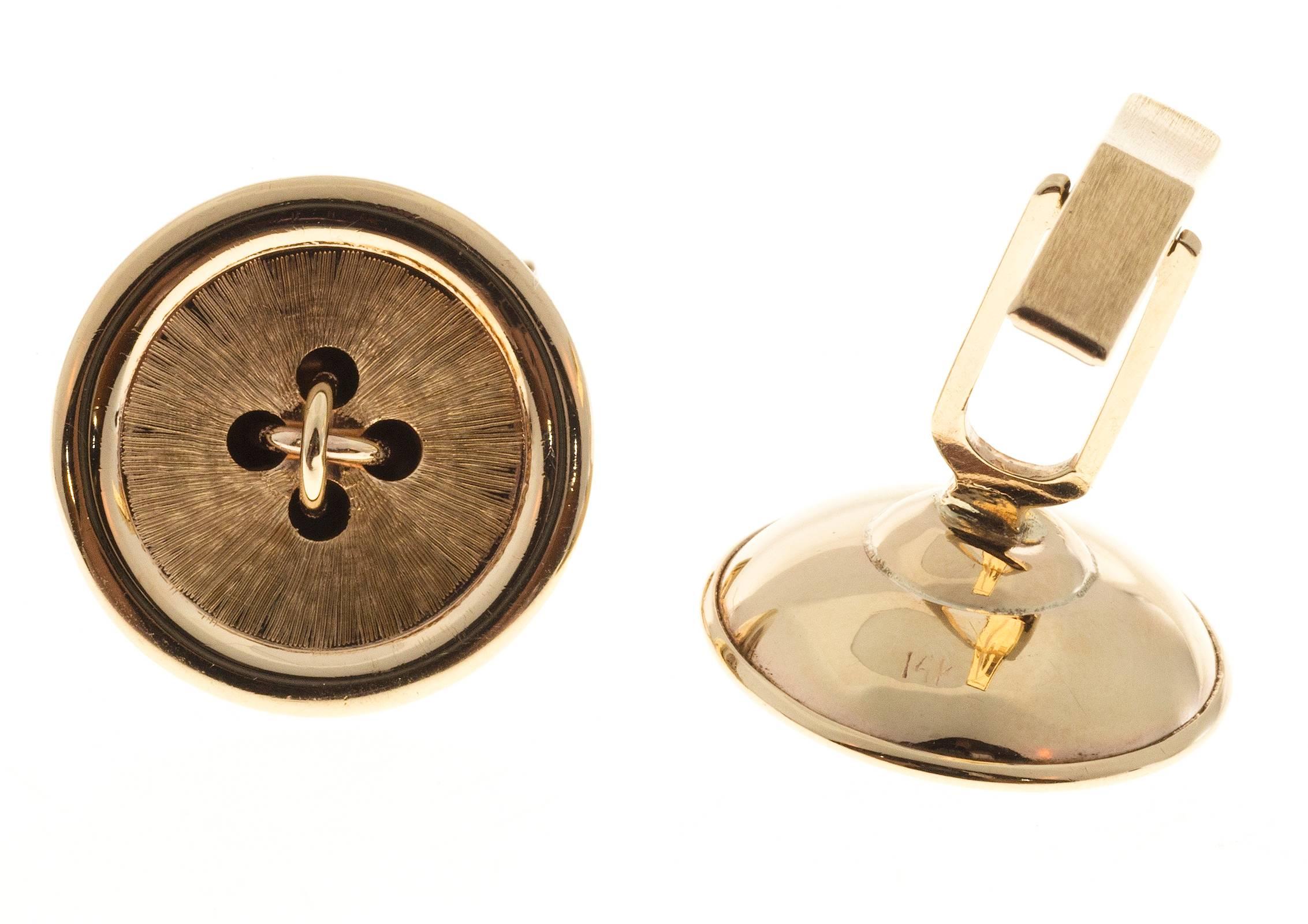 Classic solid gold 1950’s 14k yellow gold button style cufflinks.

14k yellow gold
Tested and stamped: 14k
8.5 grams
Top to bottom: 20.35mm or .80 inch
Width: 20.34mm or .80 inch
Depth: 7.33mm
