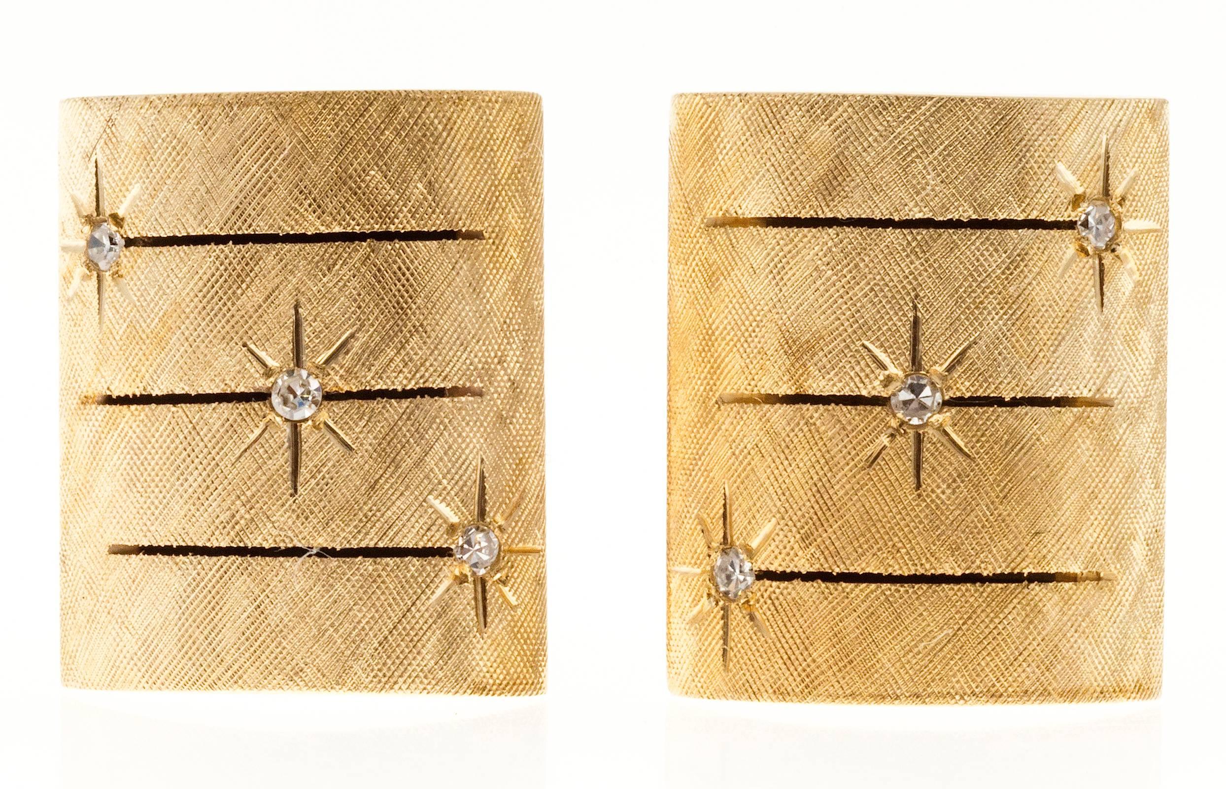 1950 domed 14k gold cuff links. Hand made with Florentine finish tops and star set diamonds. Hand Florentined finish and hand cut slits on tops.

6 star set single cut diamonds, approx. total weight .15cts, H, VS
14k Yellow Gold
Stamped and