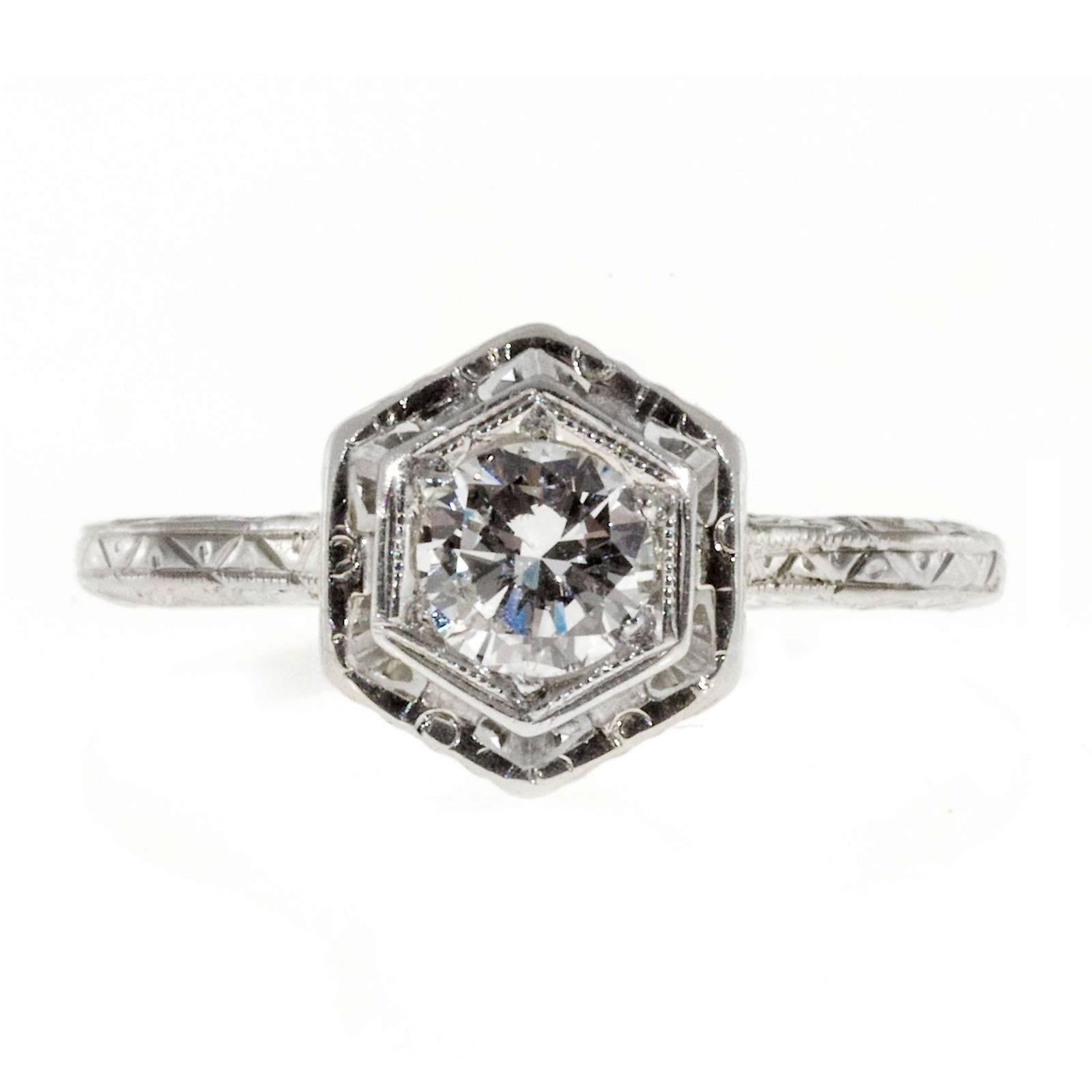Late Art Deco 1940 8 side top filigree and hand engraved original diamond engagement ring in 14k white gold. crt

1 round transitions cut white extra sparkly diamond, approx. total weight .31cts, F-G, SI1, Depth: 55.1% Table: 65%.
Size 5 and