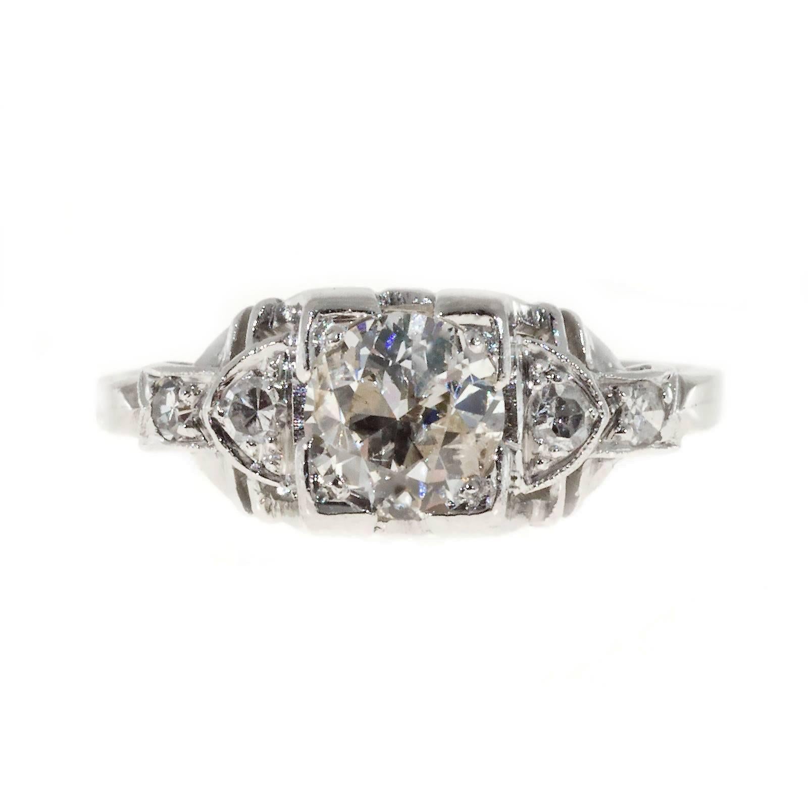  Art Deco 1930s Platinum engagement ring with square top set with one Ideal cut transitional brilliant cut diamond and four single cut diamonds. Crt

1 transitional cut diamond, approx. total weight .65cts, H - I, I1, 5.72 x 5.58mm, Depth: 61.5% 